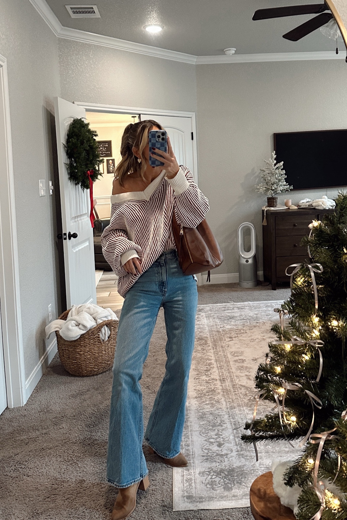 ootd! wearing my usual small in the oversized sweater and a 26 in the flares! amazon booties & bag!

#LTKFindsUnder50 #LTKSeasonal #LTKFindsUnder100