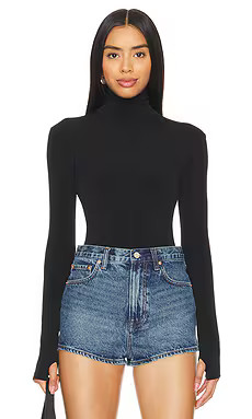 Norma Kamali Slim Fit Long Sleeve Turtleneck Top in Black from Revolve.com | Revolve Clothing (Global)