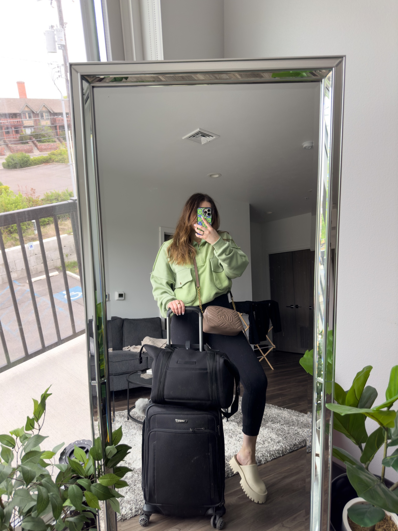 Casual and cozy travel outfit idea for spring! Featuring my favorite luggage and surprisingly comfortable shoes. 

I’m wearing size 8 leggings and size 9 clogs

#LTKSeasonal #LTKunder100 #LTKtravel