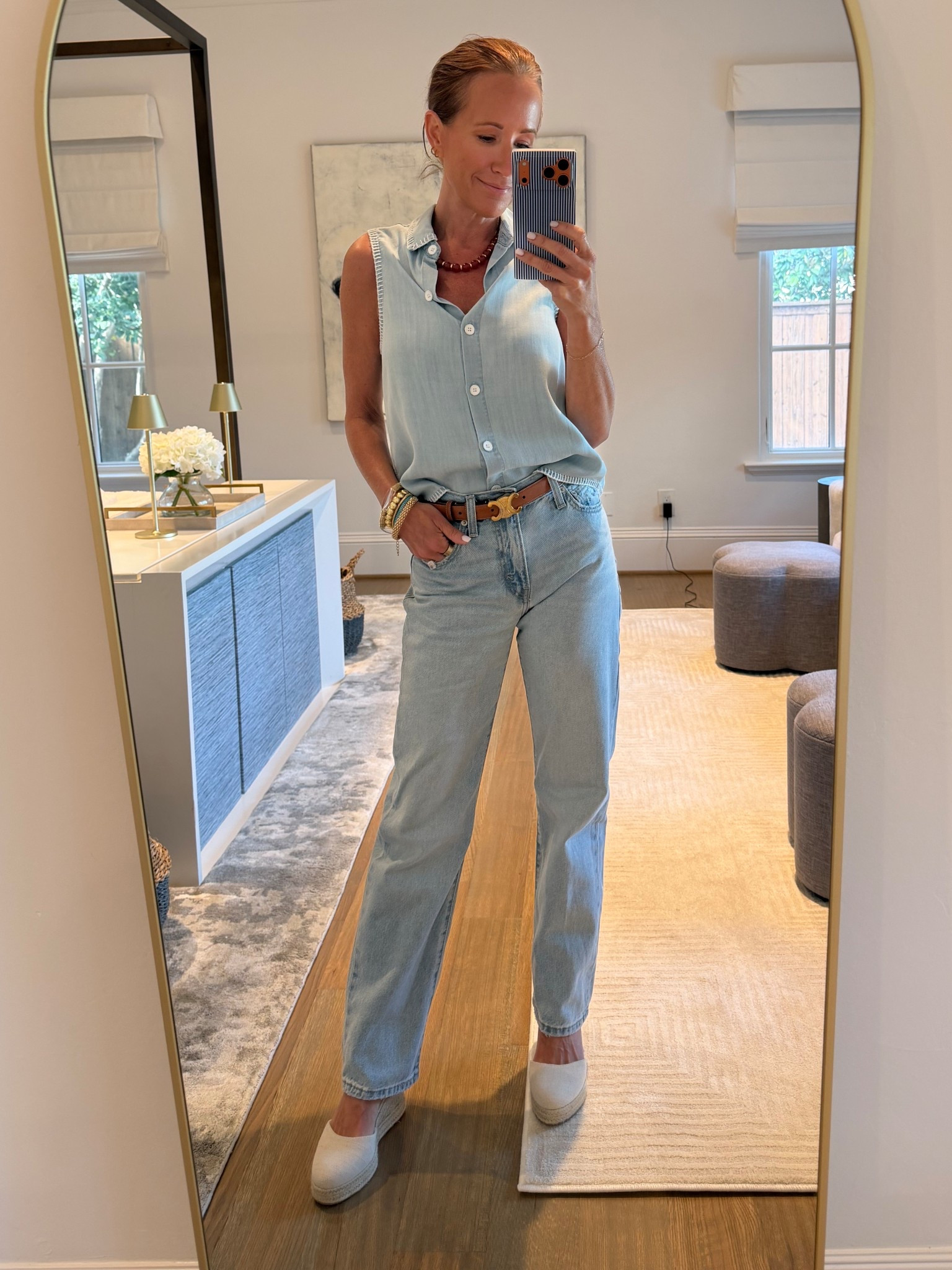 Light wash denim + an easy sleeveless button down = my go-to for effortless everyday outfits 🤍

Wearing a lightweight chambray-style top (linking similar) tucked into high waisted straight leg jeans — this fit is SO good and works for everything from school drop-offs to casual dinners. Added a neutral belt, stacked bracelets, and comfy slip-on shoes to finish it off.

If you’re looking for:
– flattering straight leg jeans
– casual mom outfits that still feel put together
– easy spring outfits with denim
– everyday elevated basics

this combo is it 👏

Everything linked here including similar top options + exact jeans and accessories.

#LTKootd #LTKOver40 #LTKPetite