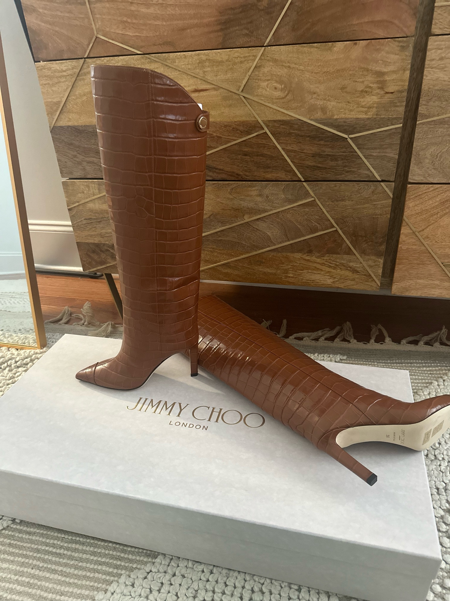 Jimmy Choo boots (on sale right now)!

#LTKSeasonal #LTKstyletip #LTKshoecrush