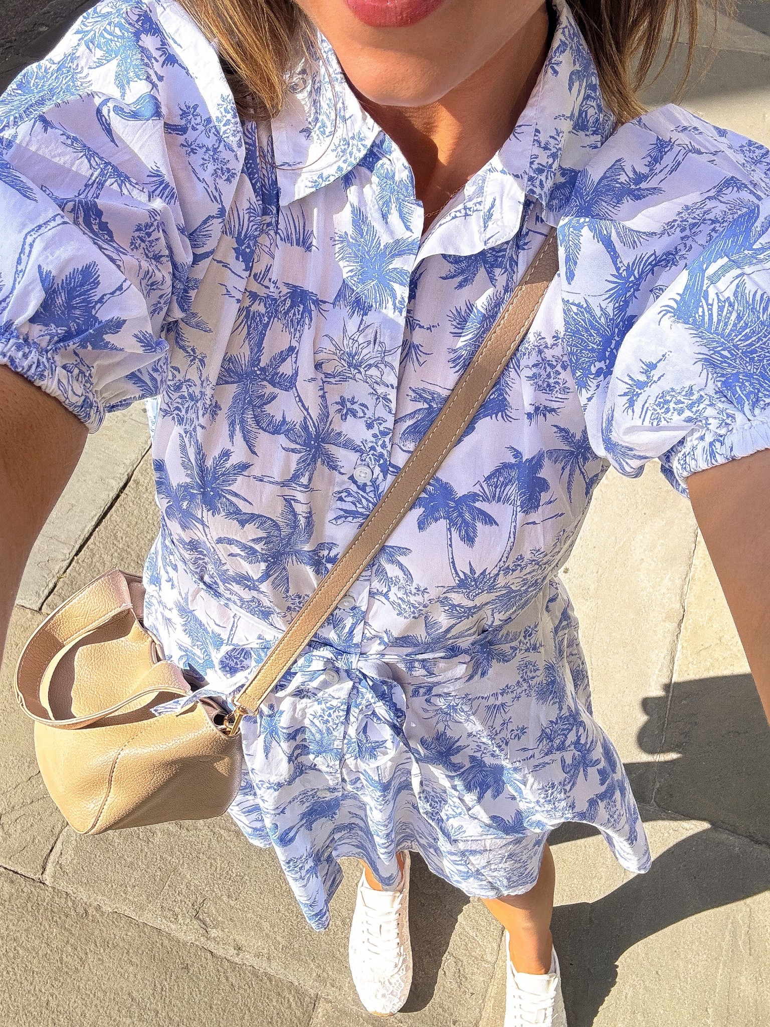 Charleston days call for breezy dresses and comfy sneakers 🌴💙 This adorable blue and white tropical print shirt dress from Target was the perfect outfit for walking around Charleston. I love the classic button-front style, the puff sleeves, and the tie waist that gives it the cutest shape. It’s lightweight, easy to wear, and one of those dresses you can throw on and instantly feel put together.

I styled it with comfy white sneakers and a neutral crossbody for a casual, effortless look that’s perfect for travel days, sightseeing, brunch, or strolling through historic Charleston. If you love easy spring and summer outfits that look polished but feel comfortable, this one is such a good find!

#targetstyle #targetfashion #targetfinds #targetnewarrivals #springdress #shirtstyle #casualoutfitideas #springoutfitinspo #charlestonstyle #traveloutfit #southernstyle #momstyle #everydayoutfit #affordablefashion #springfashionfinds 🌸

#LTKPetite #LTKTravel #LTKootd