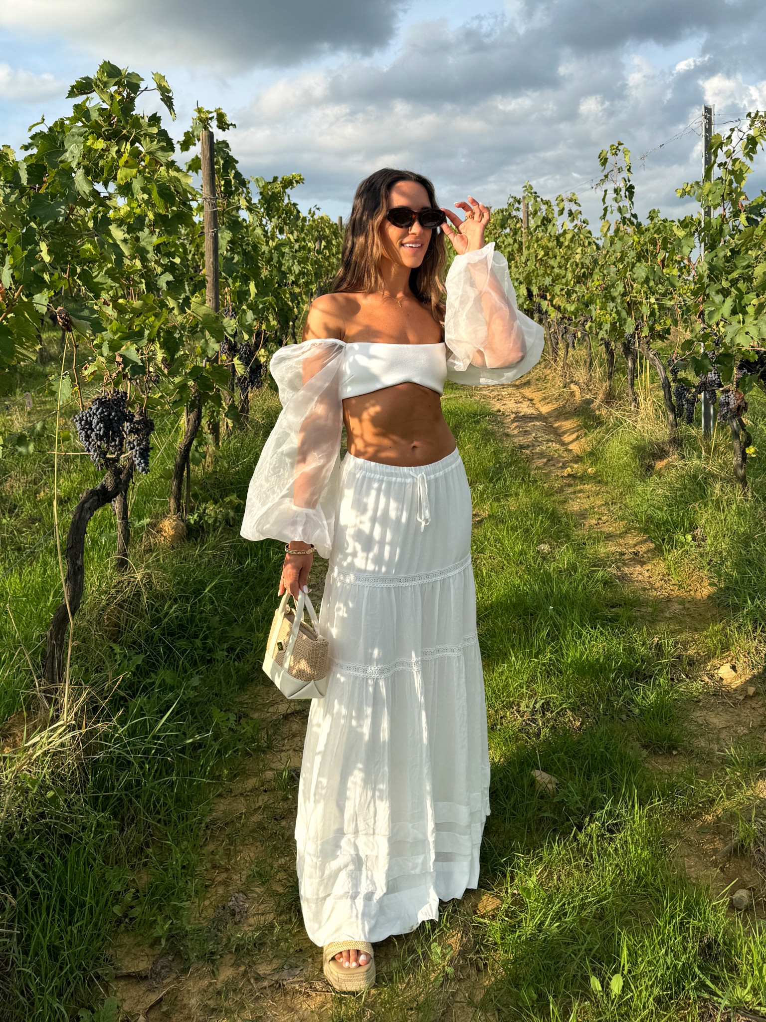 Vacation outfit from when I was at a vineyard in Tuscany, Italy 🍇
Linked a micro rattan purse that’s on sale and is ADORABLE! 

White outfit, travel outfit, Europe, summer outfit, maxi skirt, white off the shoulder top, straw bag, vacation purse, sunglasses, espadrille sandals

#LTKTravel