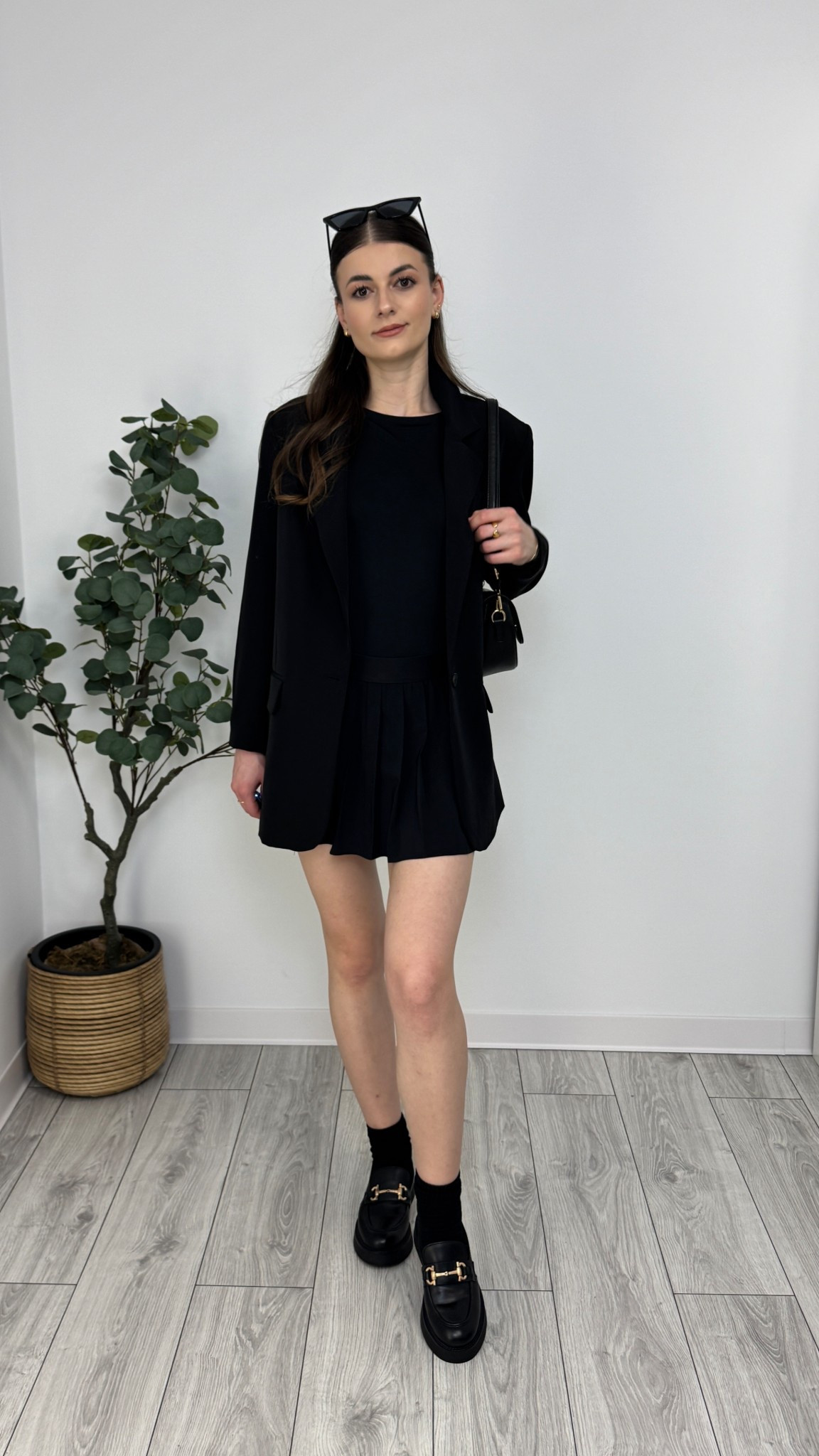 Black mini pleated skirt, black long sleeve top, black blazer, black socks, black loafers, black purse, sunglasses. A full monochrome moment that’s sleek and tailored 🖤 #IlaStylesDiary 

#LTKspring #LTKeurope #LTKworkwear