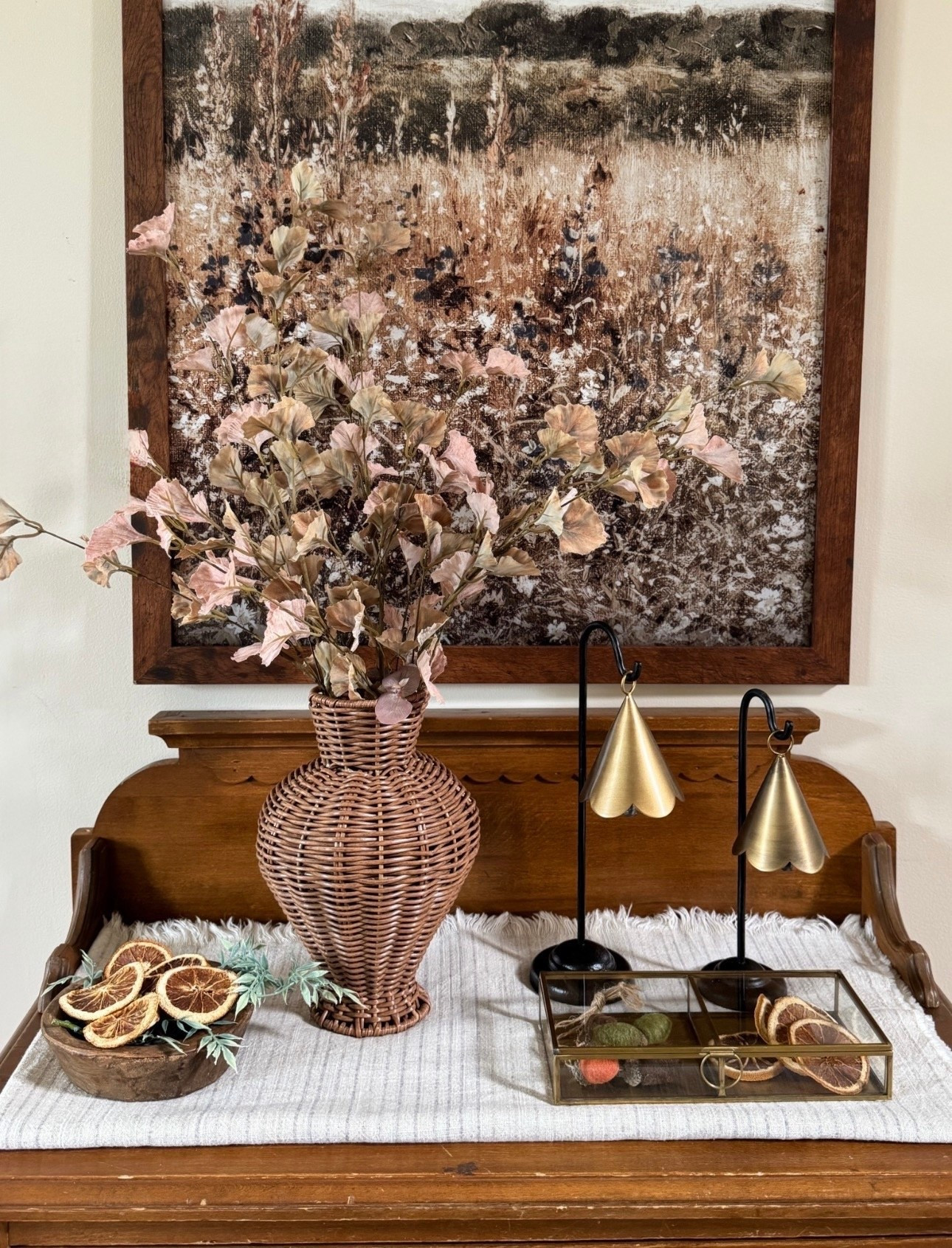The prettiest woven vase for under $15!  Rope detailed glass antique box; standing scalloped brass bells, neutral wall print and stems, plentiful bag of dried oranges. Also sharing some new Target decor, stems and their popular round wooden tray that’s back in stock. 

#LTKFindsUnder50 #LTKHome