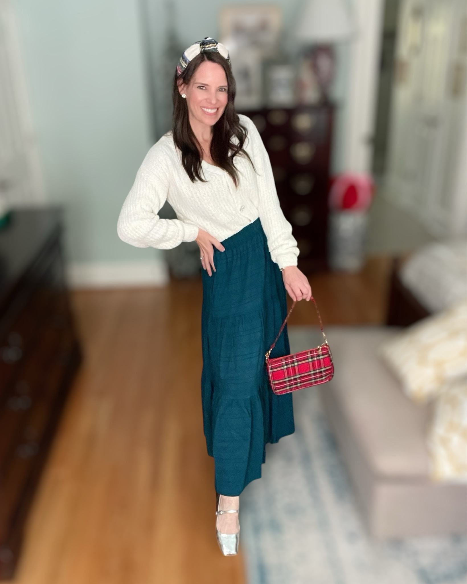 Soft holiday neutrals with a pop of tartan 🎁 I styled this flowy tiered skirt with a textured cream cardigan for that effortless, comfortable, pretty without trying too hard look. The tartan headband + plaid mini bag add just the right amount of festive, and the silver Mary Janes make it feel a little special ✨ Perfect for church, school events, dinner out, or just a cozy holiday day at home.

⸻


holiday outfit idea, christmas outfit inspiration, cozy winter outfit, a-line tiered skirt outfit, cream cardigan sweater outfit, feminine holiday style, classic holiday plaid accessories, mary jane flats outfit, affordable amazon outfit ideas, seasonal wardrobe staples, subtle festive look, winter church outfit, holiday family gathering outfit, preppy christmas style, elegant casual holiday outfit


#LTKItBag #LTKShoeCrush #LTKHoliday