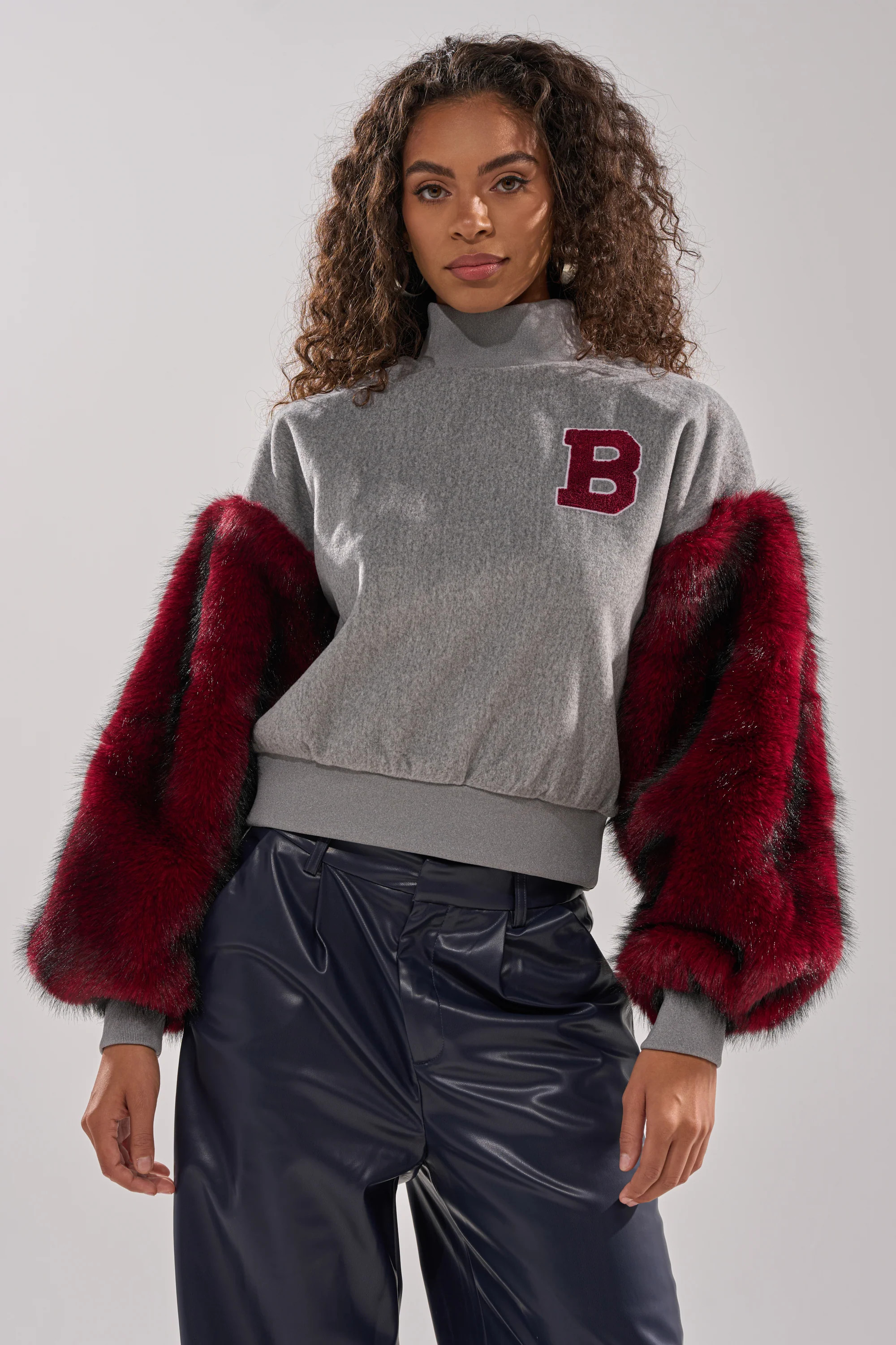 NEW EAST SIDE FAUX FUR SLEEVE SWEATSHIRT | AKIRA