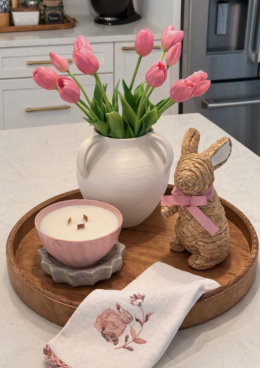 7 more days until spring! 🌱👏 It’s cold today but we’ve already enjoyed some really nice days. Most of the things on this tray will look great well into summer!  The rattan bunnies are very popular this season. The wood wick candle comes in cream as well. 🐰🌷

Spring centerpiece, faux tulips, spring refresh, Easter bunny 

#LTKSeasonal #LTKHome