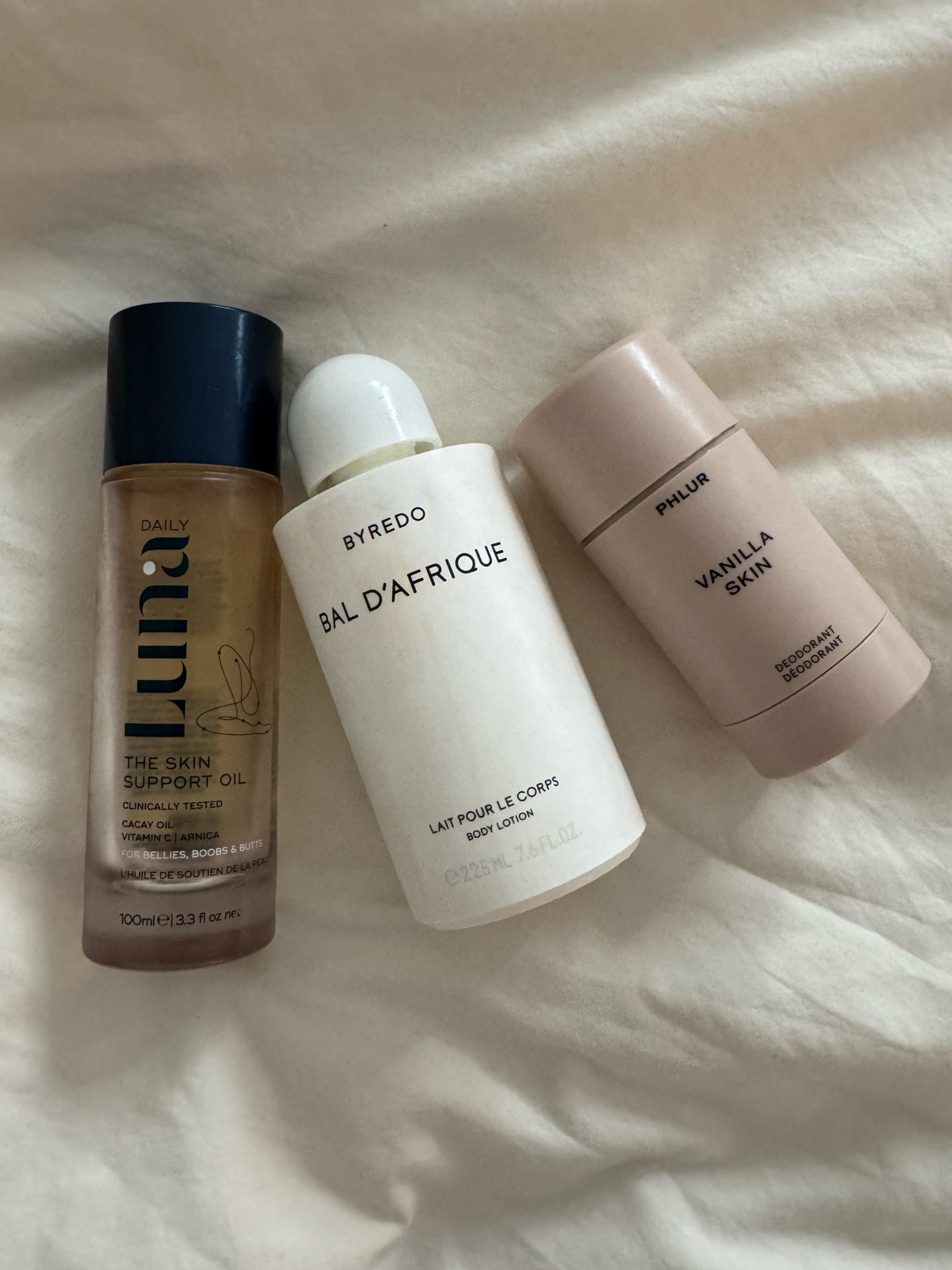 This combo will leave you smelling insane. I mix the @luna_daily_official body oil with the @officialbyredo. 
I only can use the Phlur in low activity situations (and I must reapply) but it smells so good if you're into vanilla. Keith told me I never smelled so good when using the below combo. 

#LTKBeauty