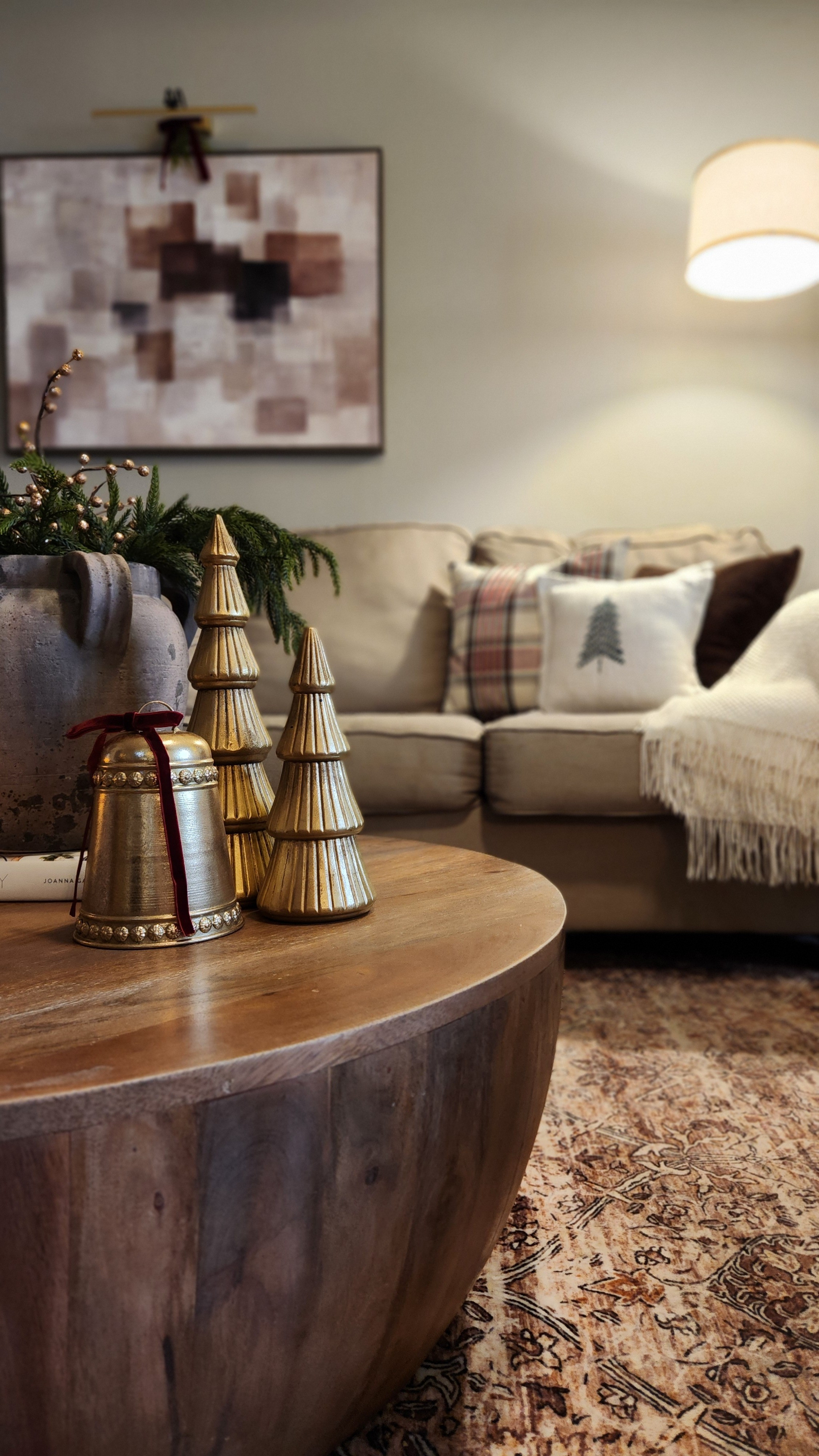 Christmas pillows, gold bell, gold christmas trees, norfolk pine stems, lamp, cozy blanket, christmas coffee table styling

#LTKHoliday #LTKGiftGuide #LTKHome