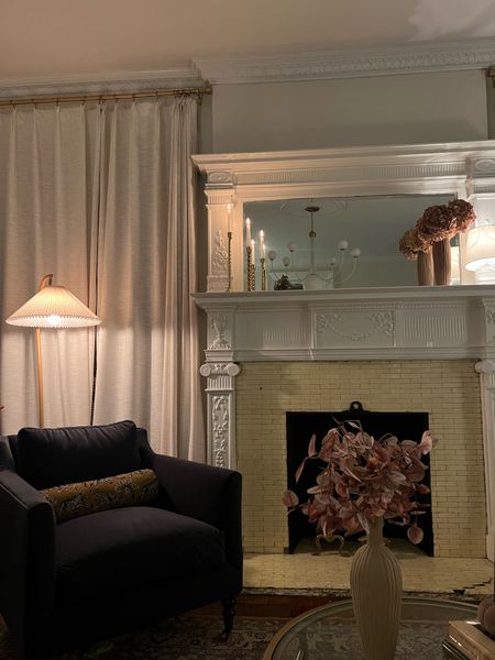 Living room at night- floor lamp, glass table lamp, gold candlesticks, velvet accent chair, bolster pillow, vase, faux stems 

#LTKSeasonal #LTKhome #LTKstyletip