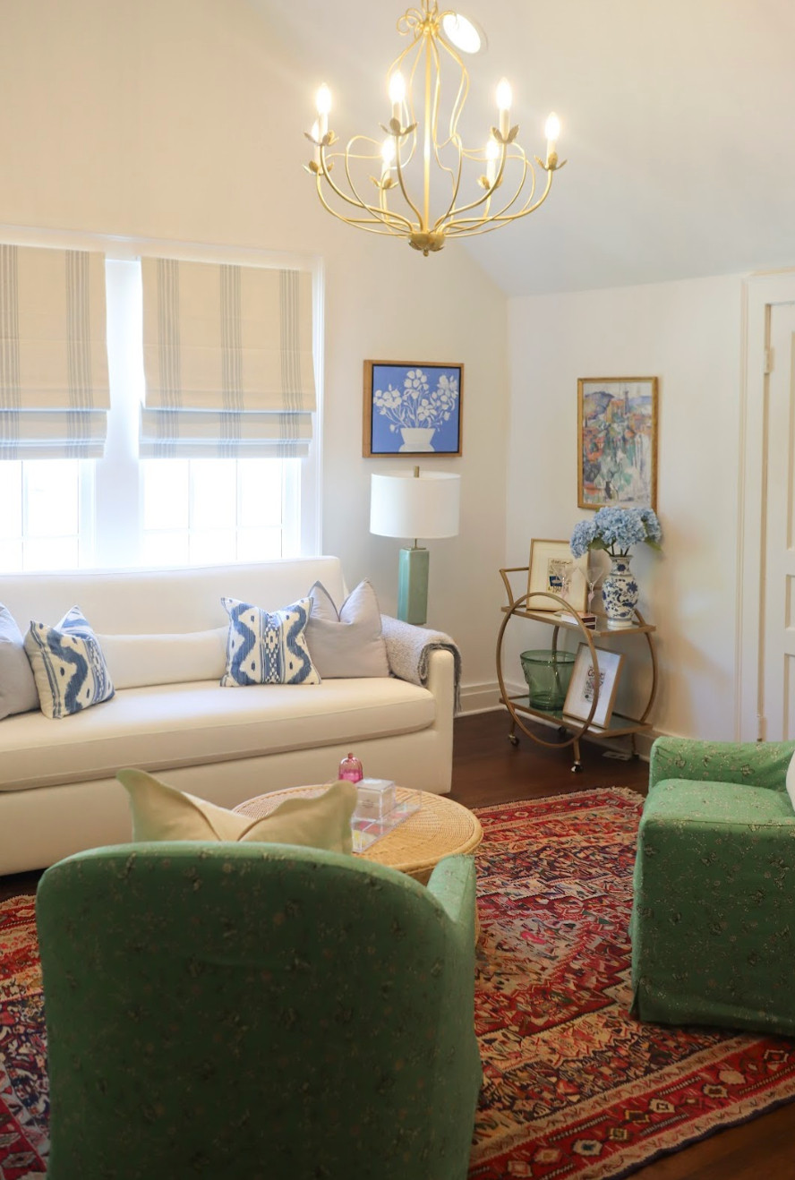 This living space is a cozy, artful lounge. Focusing on thoughtful decluttering, smart storage solutions, and updated decor, the space is both functional and inviting. Inspired by Art Deco style, we layered in elegant colors, eclectic details, and timeless touches to give the room character and warmth. The result is a cozy, elevated retreat where family can relax, read, and gather together.💫 

 #artdecoinspired #familyroommakeover #cozystyle #LTKHome #LTKFamily