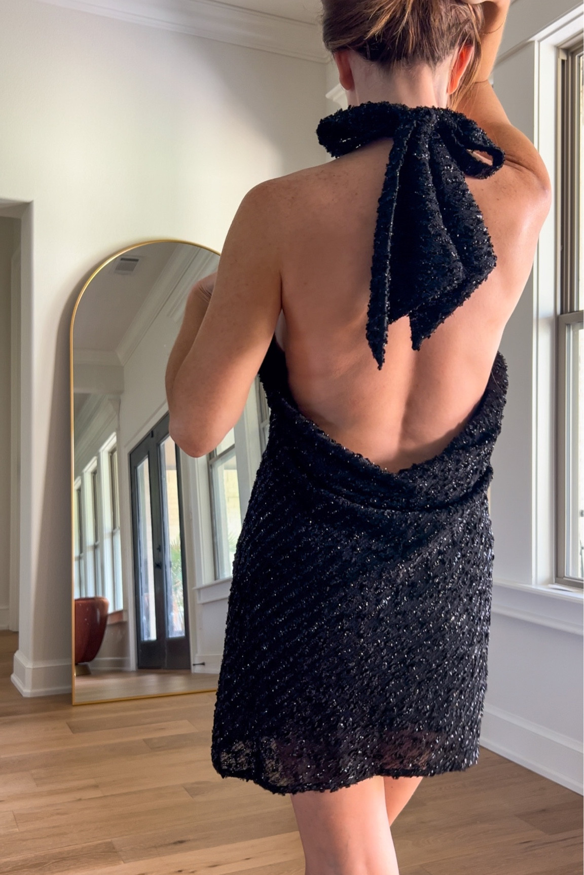 A little commotion for the back of the dress. This little black dress has the right touch of shimmer and it’s shown knotted but how could I pass up doing a bow on the back here? 

Little black dress, party dress, cocktail dress, wedding guest attire 

#LTKparties #LTKwedding