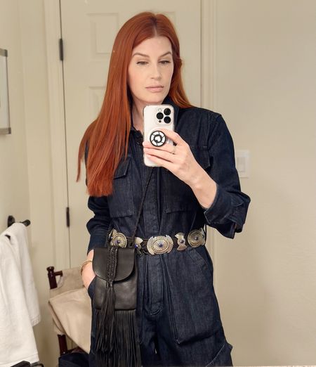 My jumpsuit is 40% off!!!
I am wearing a size small but might have needed a medium for more room in the length.
This denim is super thick and I layered thermals underneath to keep me warm. It comes with a cute denim belt but I swapped it for this sterling silver concho belt for some west Texas flare. 

#LTKFind #LTKSeasonal #LTKtravel