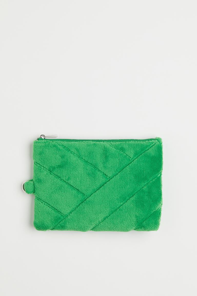 Pouch bag with a zip at the top and a metal D-ring on one short side. Lined. Size 9x12.5 cm. | H&M (US)