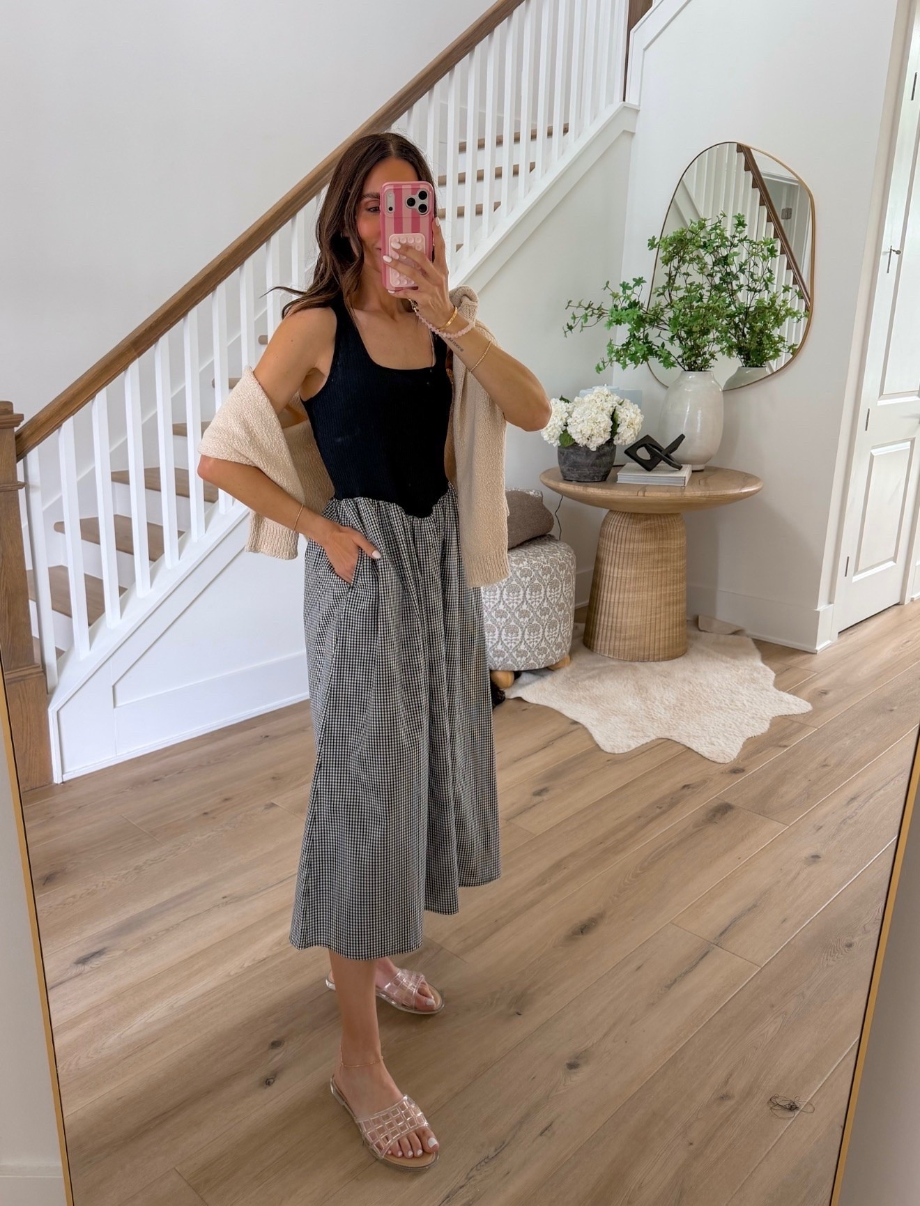 This outfit is such a great mix of comfortable and polished. The black tank keeps it classic, while the gingham wide leg pants add just enough interest to make it feel elevated. Tossing a lightweight sweater over your shoulders is the perfect finishing touch for cooler mornings, restaurants, or travel days.

Gingham pants, black tank, wide leg pants, casual chic, elevated basics, summer outfit, travel outfit, neutral style, everyday fashion, effortless outfit, capsule wardrobe, comfortable style, Annabrstyle

#LTKootd #LTKSeasonal #LTKOver40