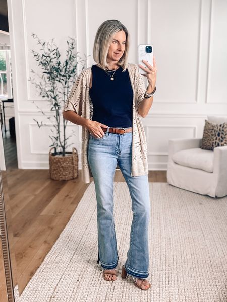 ⭐️ These bootcut jeans are so good! I love the side slits and the frayed hem. Wearing a 2. Eyelet crochet cardigan is so pretty and comes in other colors. Wearing a small in the top and cardigan. Perfect date night outfit or girls night out! 

#LTKOver40 #LTKStyleTip #LTKFindsUnder100