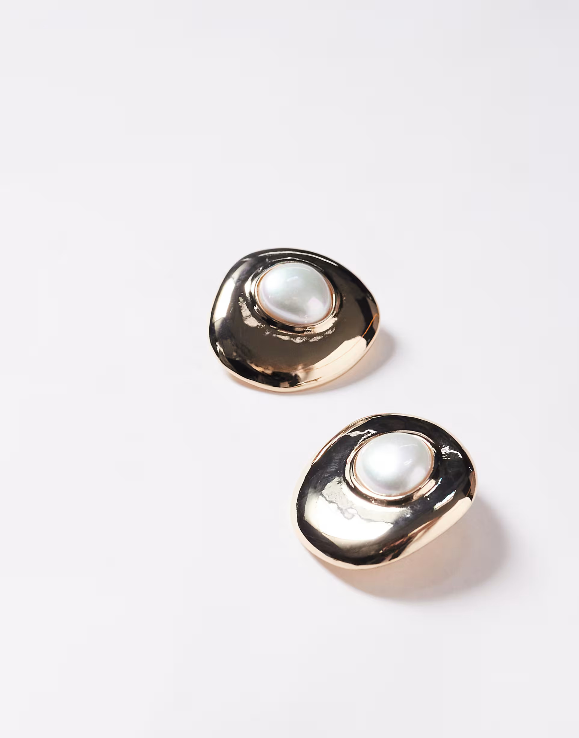 ASOS DESIGN stud earrings in abstract circle with pearl design in gold tone | ASOS (Global)