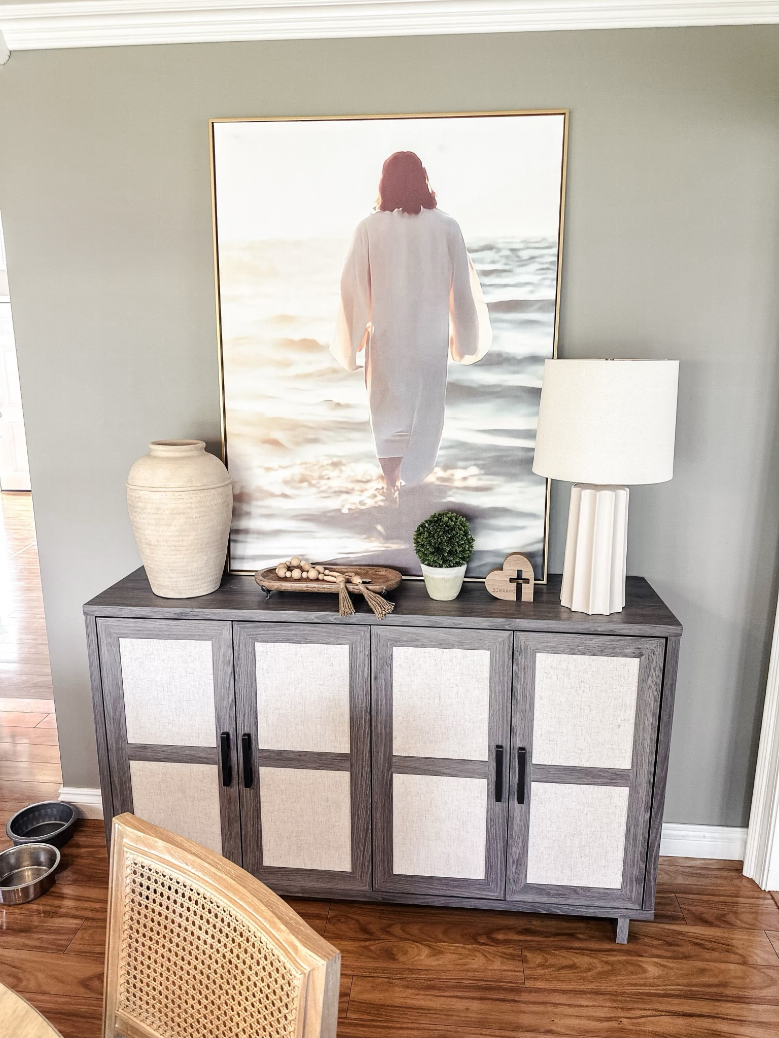 It's incredibly rewarding when a former client loves your vignette so much that you get to recreate and elevate a similar one just for her. She admired the Jesus artwork I won in a giveaway a few years ago, and we found a similar piece to bring her space to life and add meaning. A tall vase and a lamp at each end of the console provided balance to the smaller pieces in the center.

I do miss helping people transform their houses into homes but for now, I’ll be sharing past projects and ideas to help you get your home on track 🫶🏼

If you want to know where the Jesus art came from, check out my instagram @mydesignhaven. The account is linked in the post. 

#LTKStyleTip #LTKSaleAlert #LTKHome