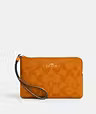 Corner Zip Wristlet In Signature Canvas | Coach Outlet US