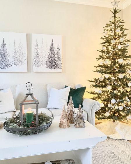 Christmas tree decorations, Christmas decor, Christmas prints, tray styling, holiday lantern display, rustic trees, neutral decor, green and white Christmas decor  

#LTKhome #LTKHoliday #LTKSeasonal
