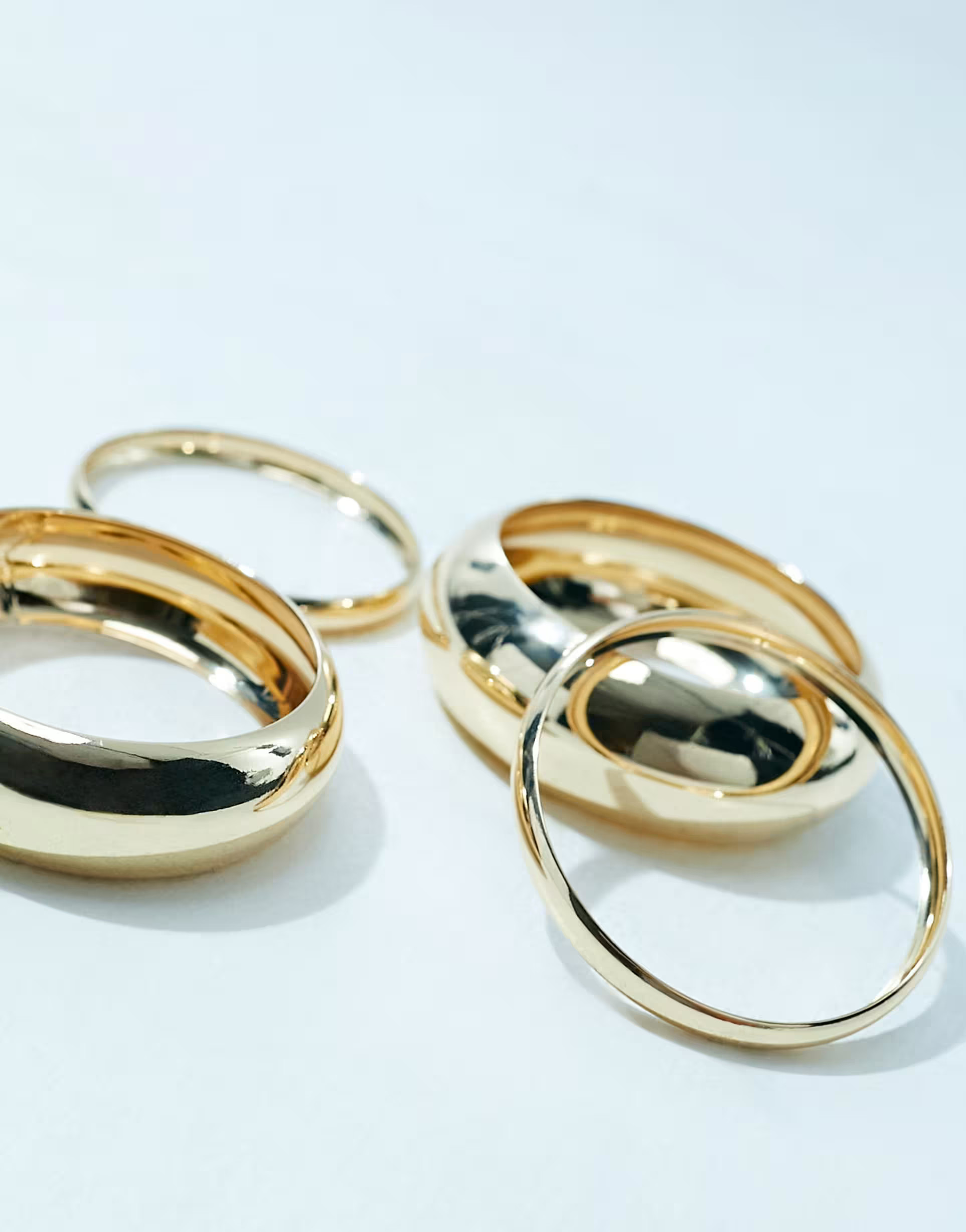 ASOS DESIGN Curve 4-pack bangle bracelets in mixed design in gold tone | ASOS | ASOS (Global)