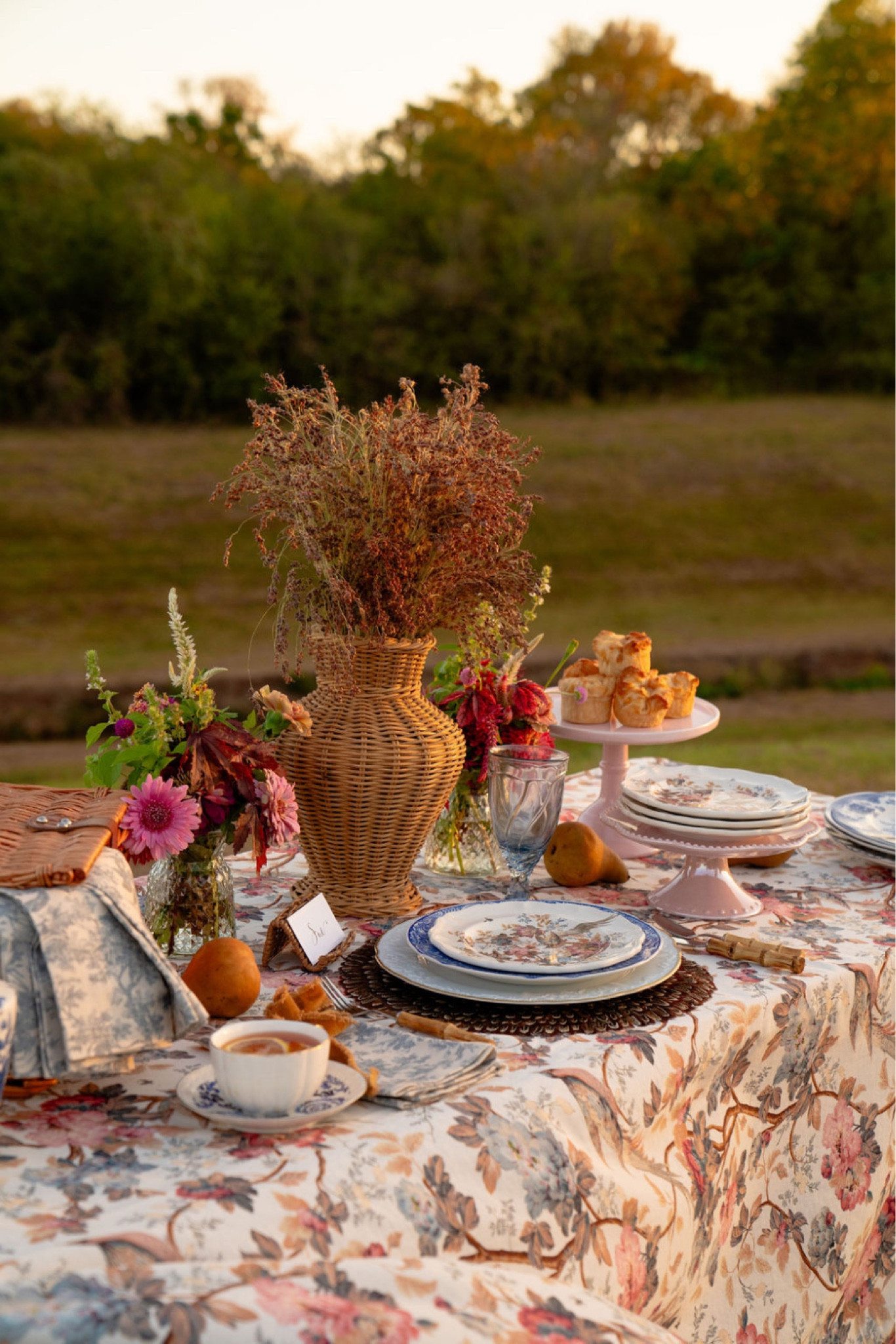 Fall is the best time of year for Al fresco dining and this beautiful blue, white, and bronze fall harvest Tablescape will surely impress. Decorate your table with florals this fall and elegant blue and white tableware. A printed floral table cloth is also necessary! BLUE AND WHITE TABLESCAPE. BLUE AND WHITE PLACE SETTING. BLUE AND WHITE CHINA. BLUE AND WHITE PLATES. FLORAL TABLE DECOR. FLORAL TABLE CLOTH. FALL HARVEST TABLE. FALL HARVEST TABLE SETTING. 

#LTKhome #LTKSeasonal #LTKHoliday