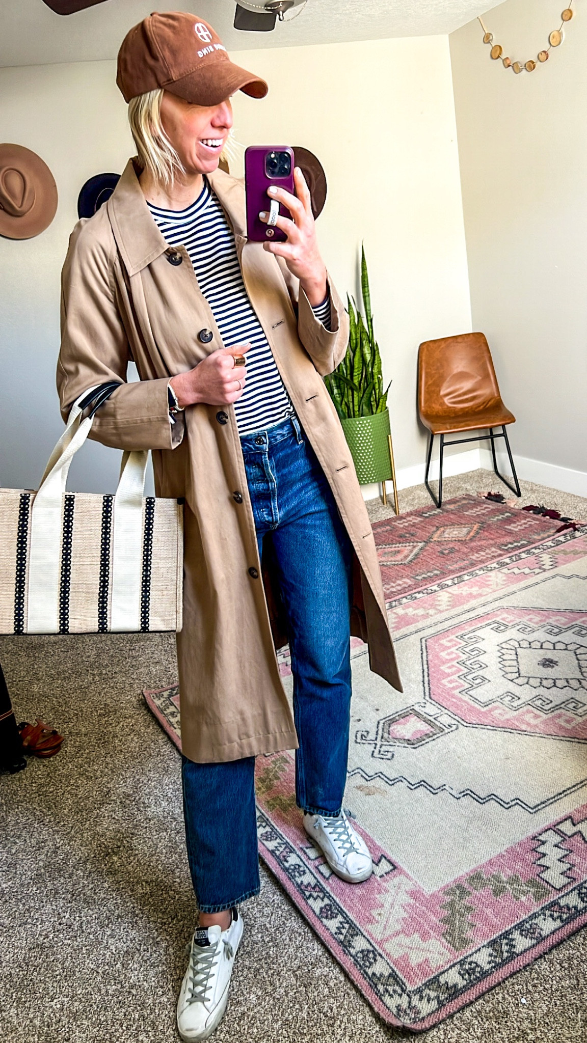 Spring staples: stripe tee, straight leg jeans, trench coat, sneakers, tote 

#LTKFind #LTKstyletip #LTKSeasonal