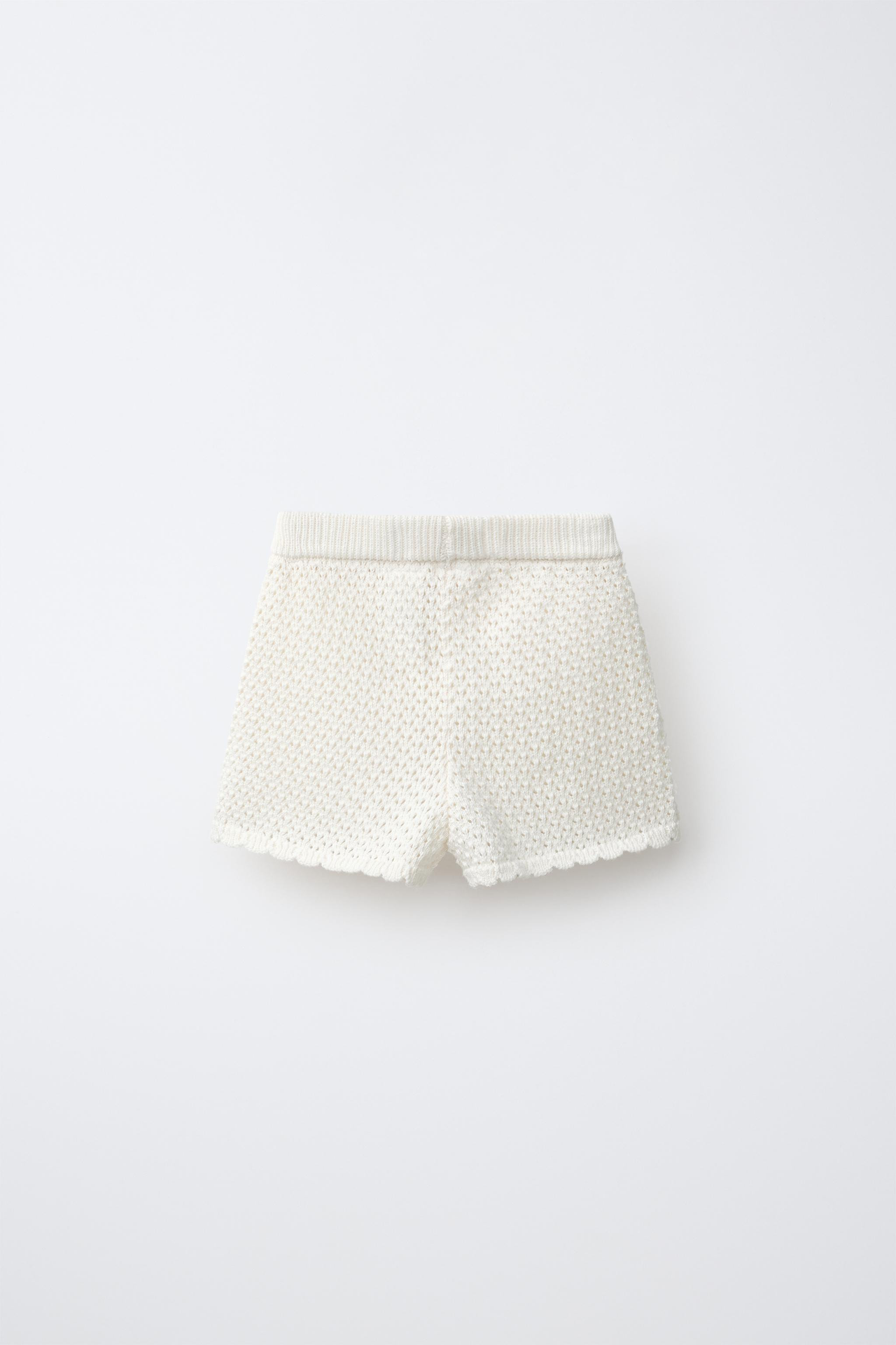 Knit Bermuda shorts with an elastic waistband. Featuring appliqu\u00e9s on the sides and wavy hem... | Zara UK