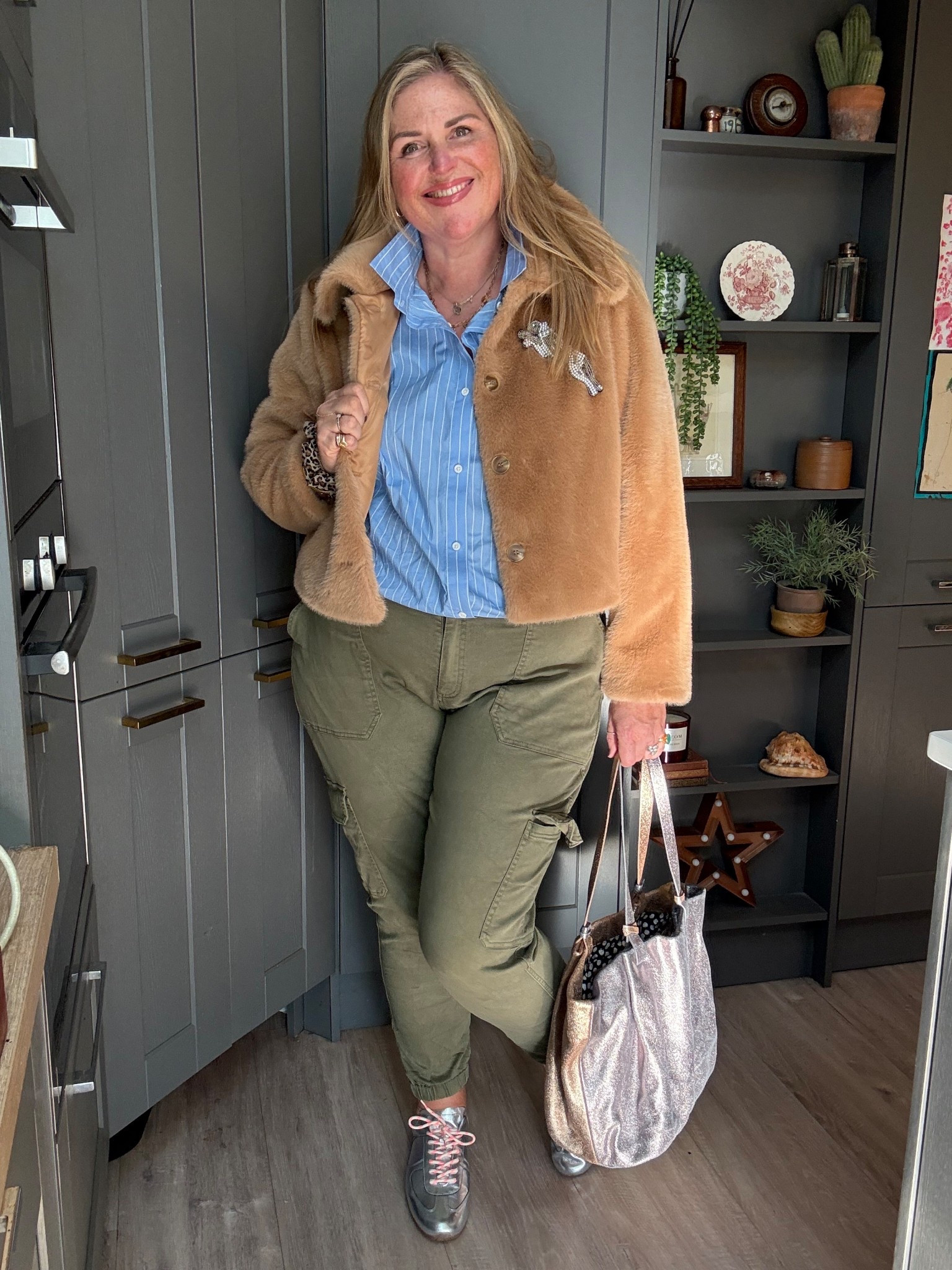 Faux fur jacket, striped blue shirt, khaki trousers, silver bag, silver trainers 

#LTKcurves #LTKautumn #LTKplussize