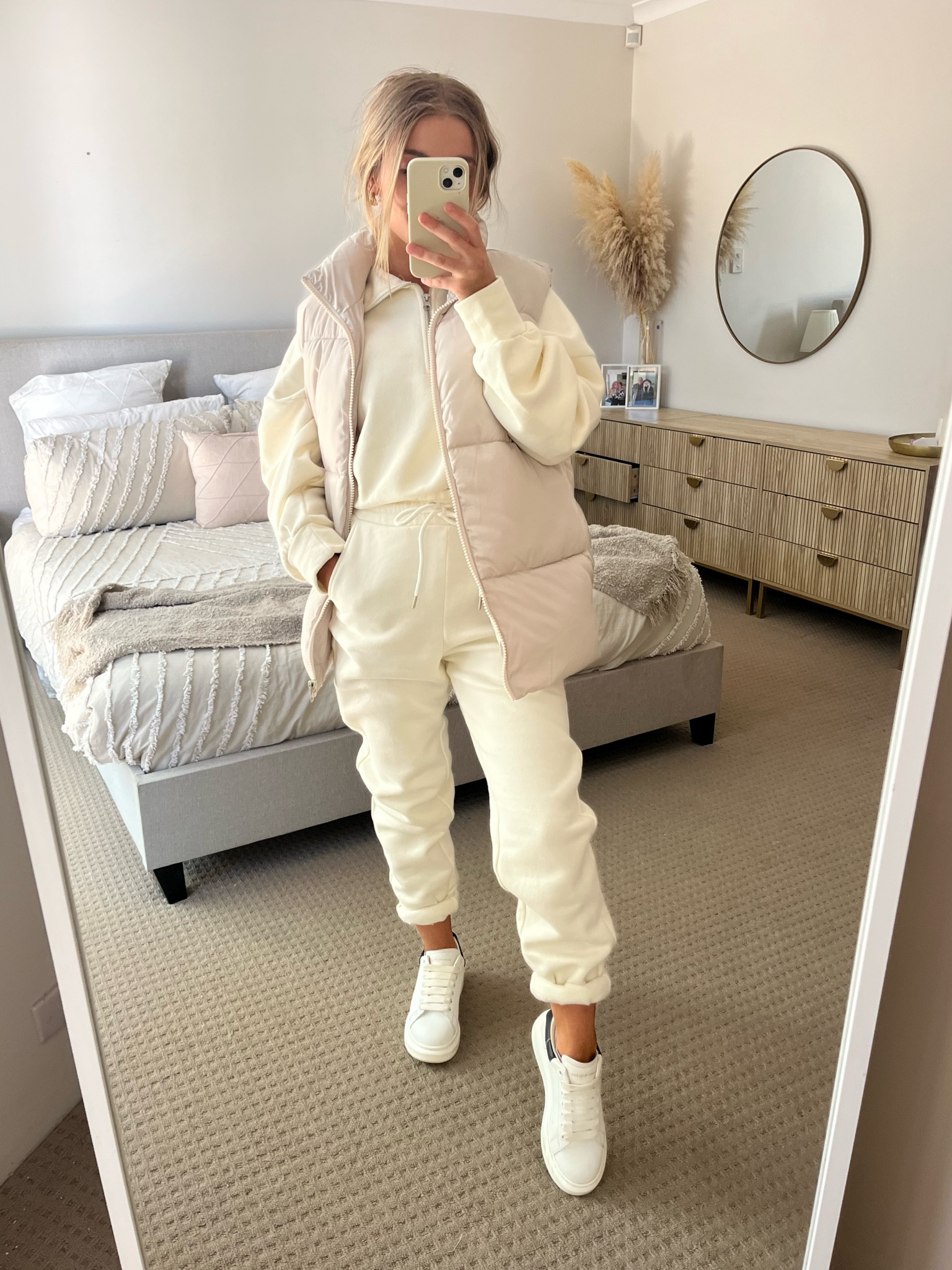 Cream sweat - I’m wearing a size large. Usually I’m a XS  but I really like the over sized look.

Pants -I’m wearing a size XS and they’re still and oversized fit so I recommend with the pants ordering true to size. 

Vest- this is a Man’s vest, which doesn’t matter its just means you might have to order a size down as men’s sizing tends to run bigger. I’m wearing a size 2XS 