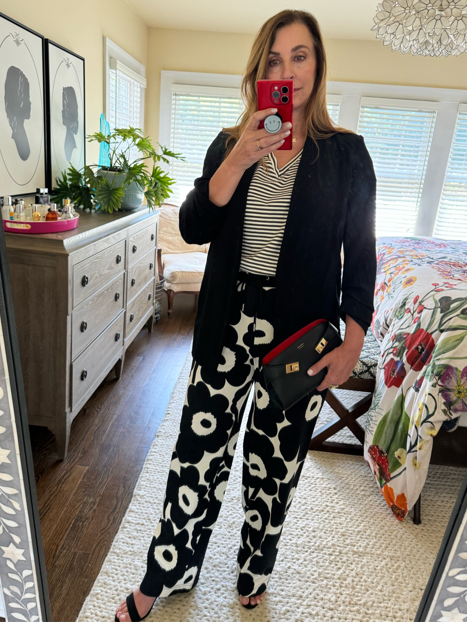 There is something about classic black and white that is so chic. These floral pants take things to the next level and you won’t believe how comfortable they are (they’re sweatpants). 
My favorite black blazer with ruched sleeves that fall above the wrist and a bag that comes with a pop of red!

#LTKParties #LTKMidsize #LTKOver40