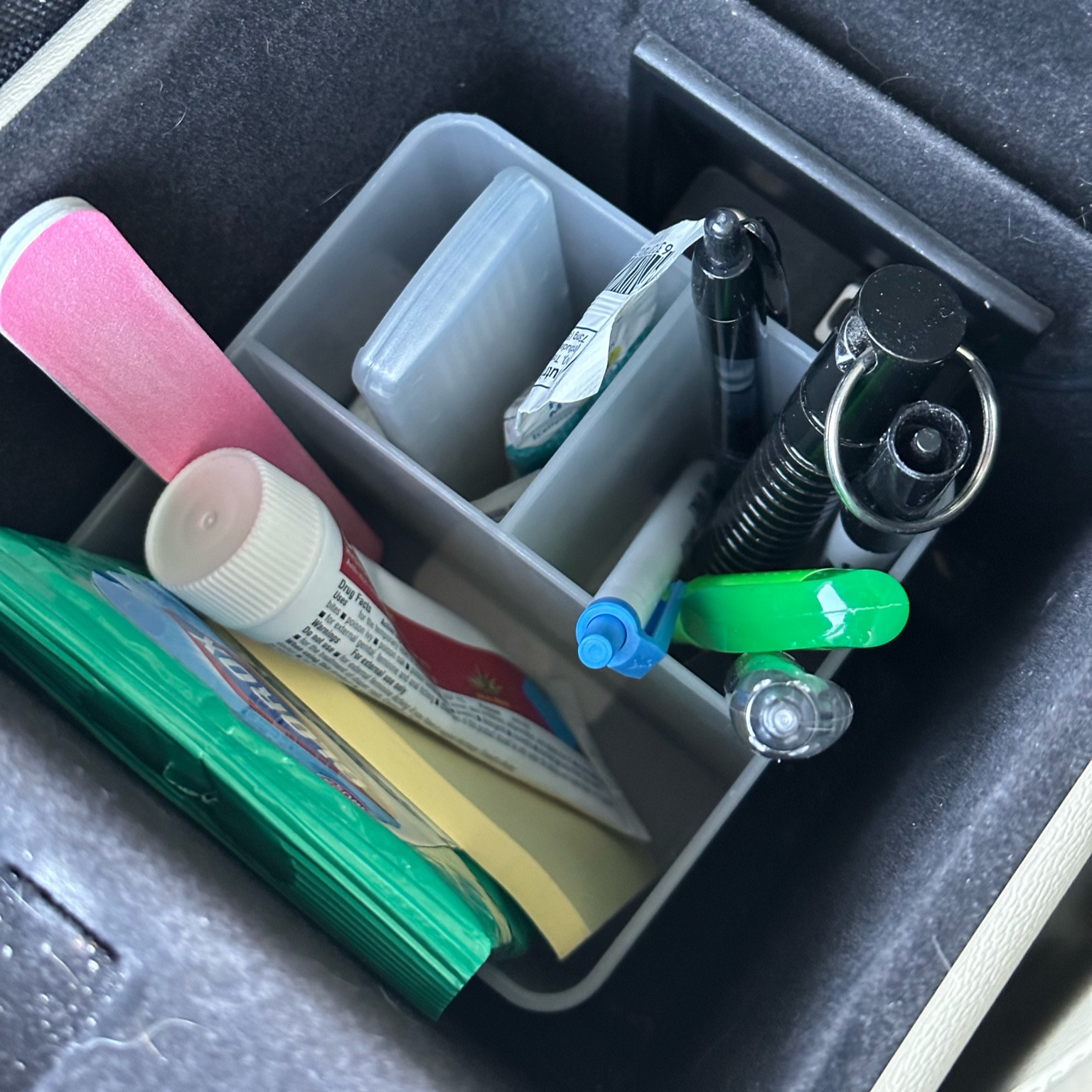 Organize a small suv center console with a basic pencil cup. This Target find is inexpensive and helps keep my car organized  