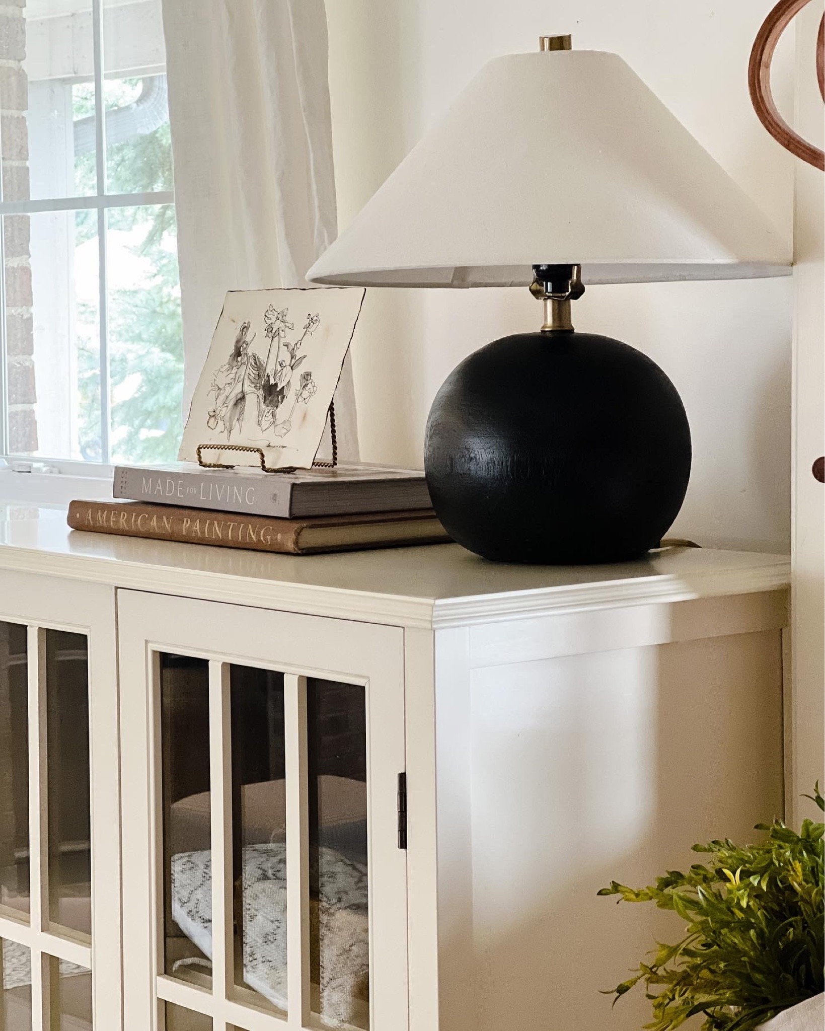 Cabinet styling

#whitecabinet #blackroundlamp #lamp #amberbook #whitecurtains #coffeetablebooks

#LTKunder100 #LTKhome #LTKunder50