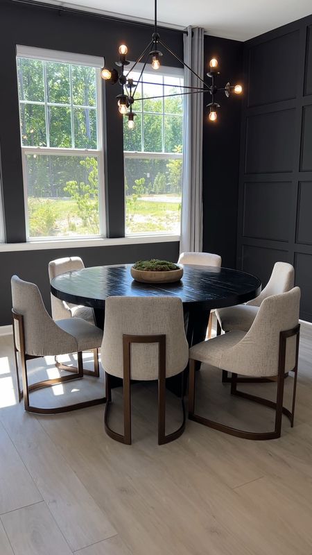 Modern Dining Room: Cream Dining Chairs with brass metal back and legs, Black round stylish dining table and modern Sputnik chandelier

#LTKhome #LTKstyletip #LTKVideo