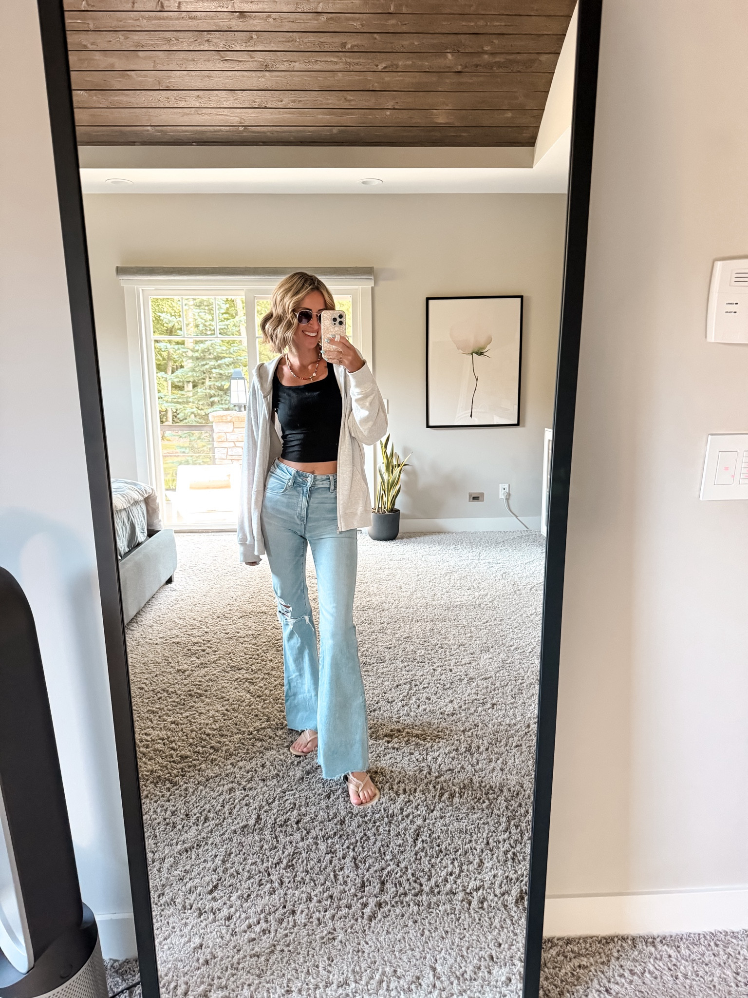 Fall outfit ideas and what to wear early fall when it’s chilly in the morning 
I love these ripped leg flare jeans. They’re the perfect rise to wear with this crapped, baby T and I threw on my absolute favorite oversized hoodie to stay warm, it is so soft and comes in several colors.