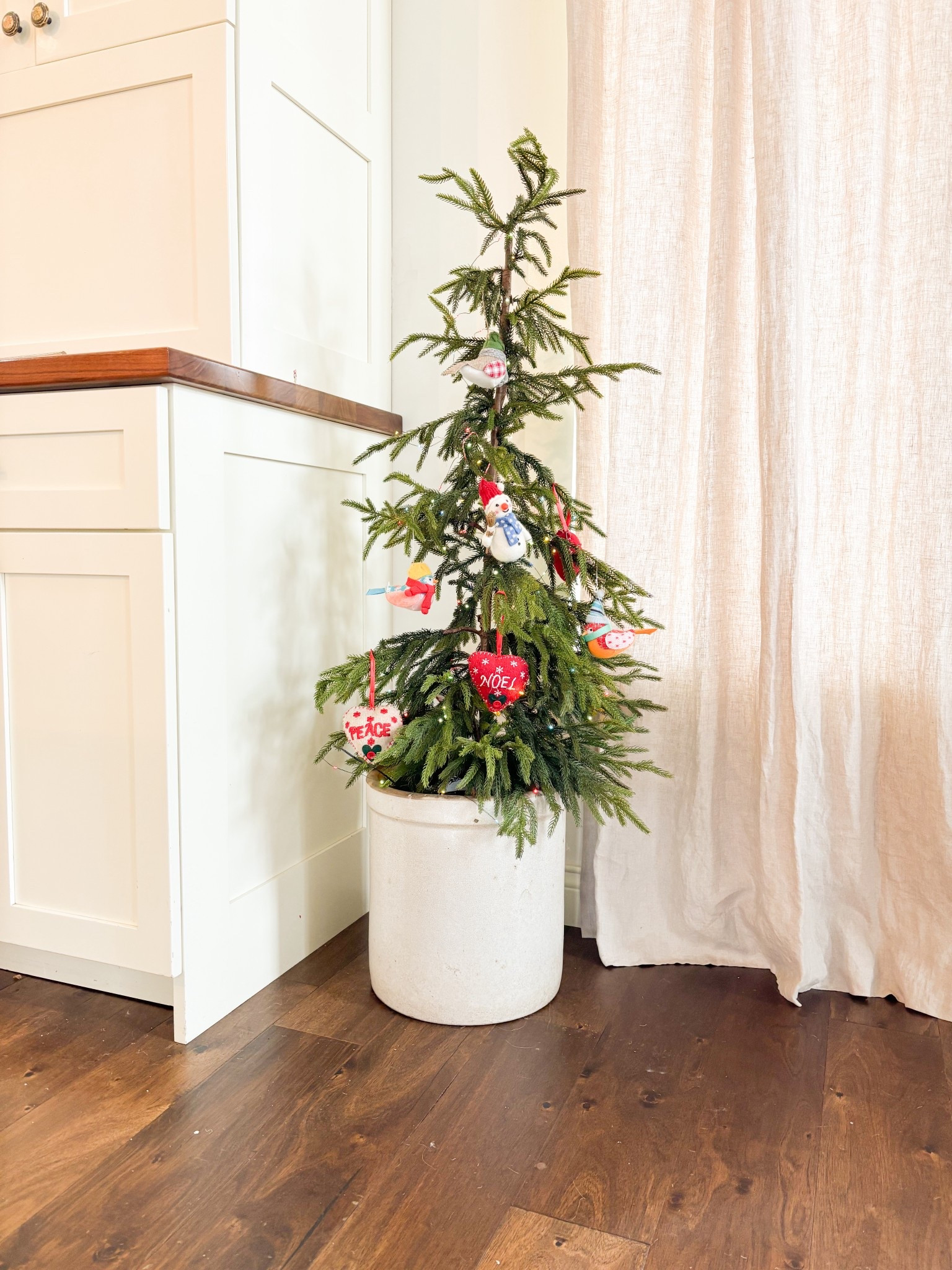 Snowing today and started to decorate just a bit. 
I love these wool ornaments and the simplicity of this tree although I will probably add just a bit more to it later.  

Lights are battery powered on a timer- love the color twinkle! 

#LTKHoliday #LTKFindsUnder100 #LTKFindsUnder50