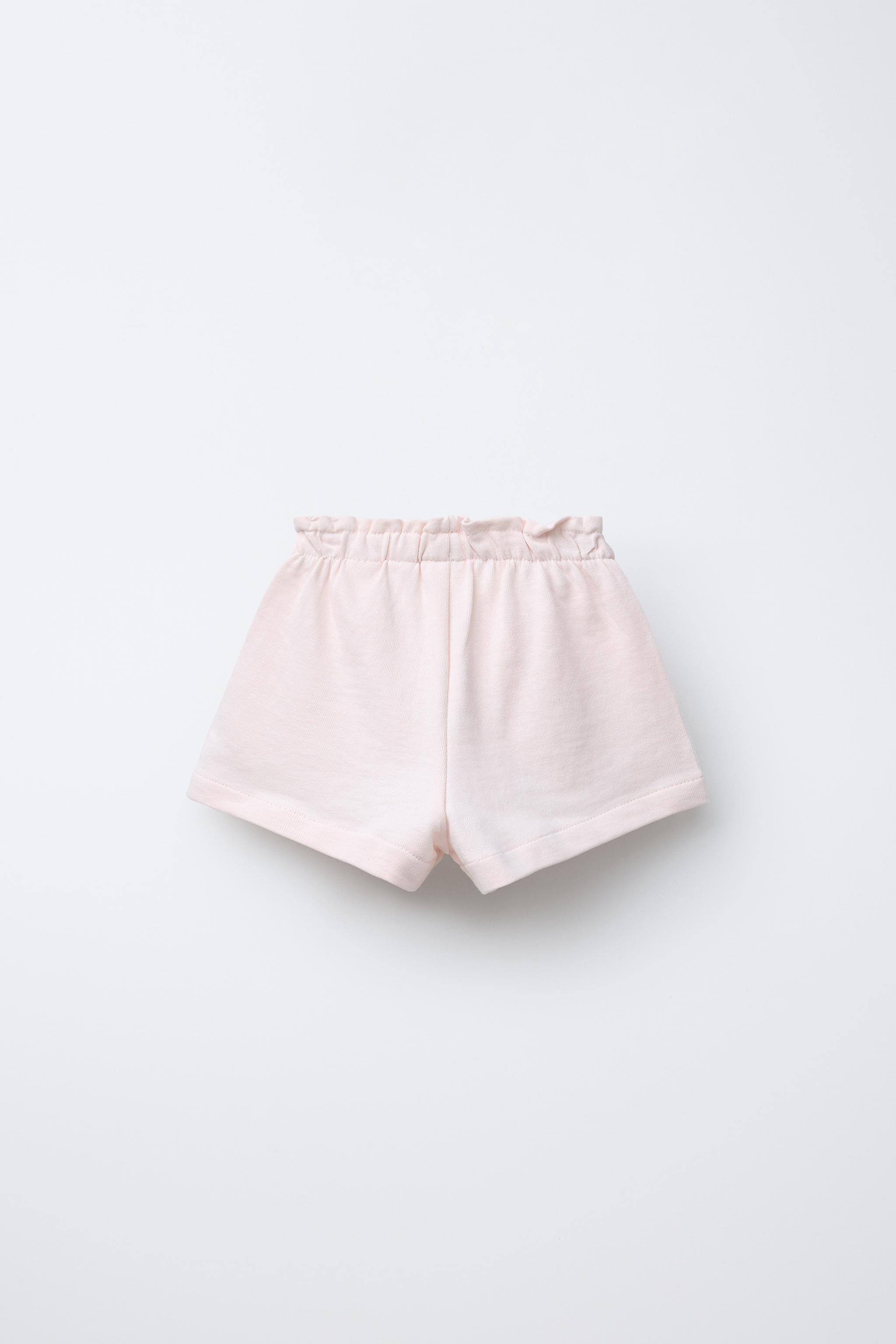 Plush Bermuda shorts with an elasticated waistband and drawstring. Front pockets and embroidered ... | Zara UK