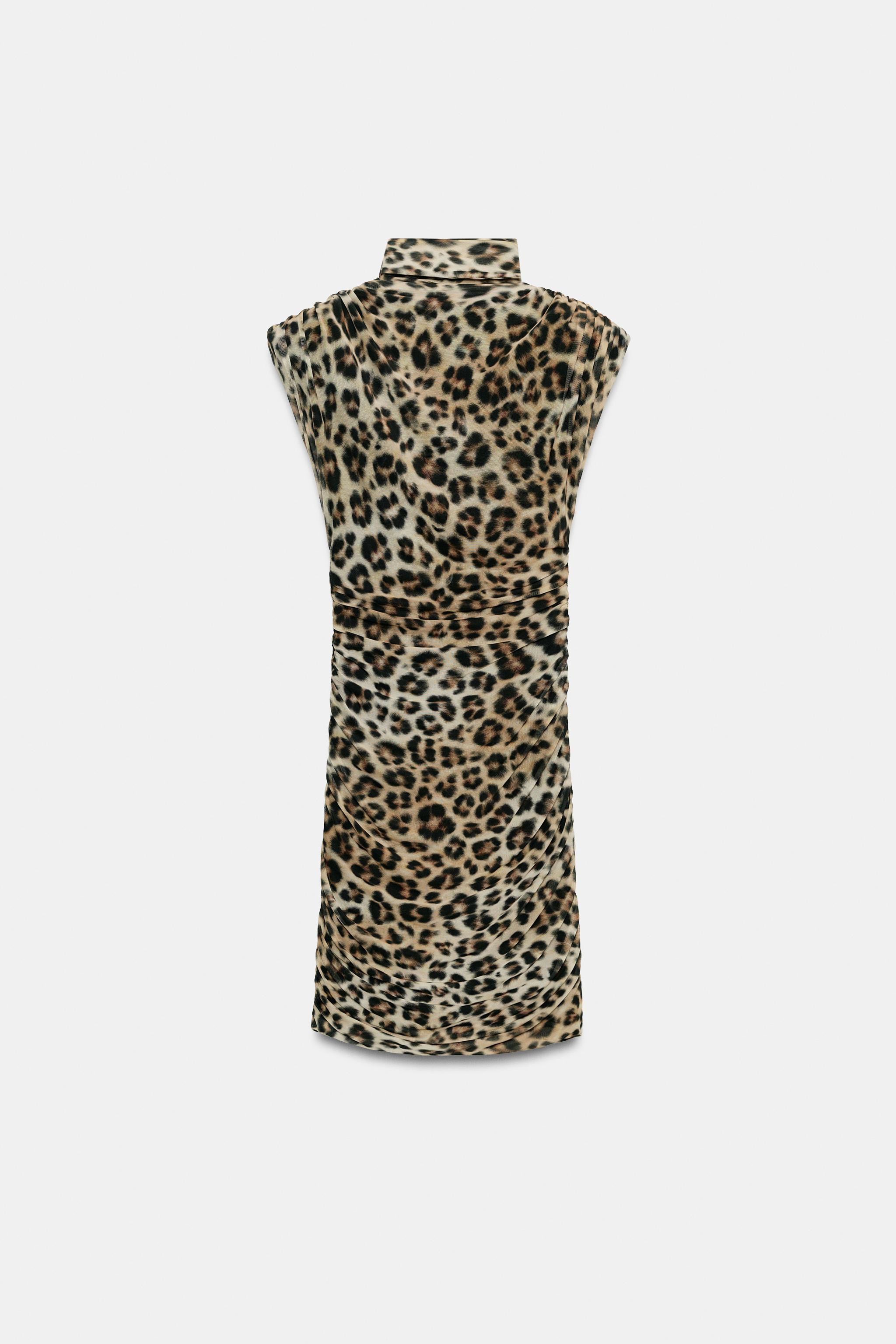 Mini dress with a deep draped neckline and sleeveless design with shoulder pads. Features a scarf... | Zara US