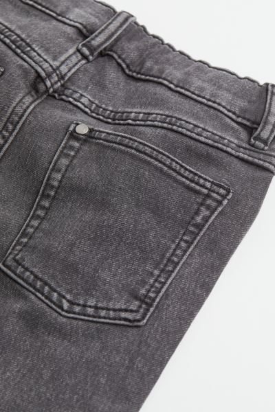 Relaxed-fit, 5-pocket jeans in supersoft stretch denim. Adjustable, elasticized waistband, mock f... | H&M (US + CA)