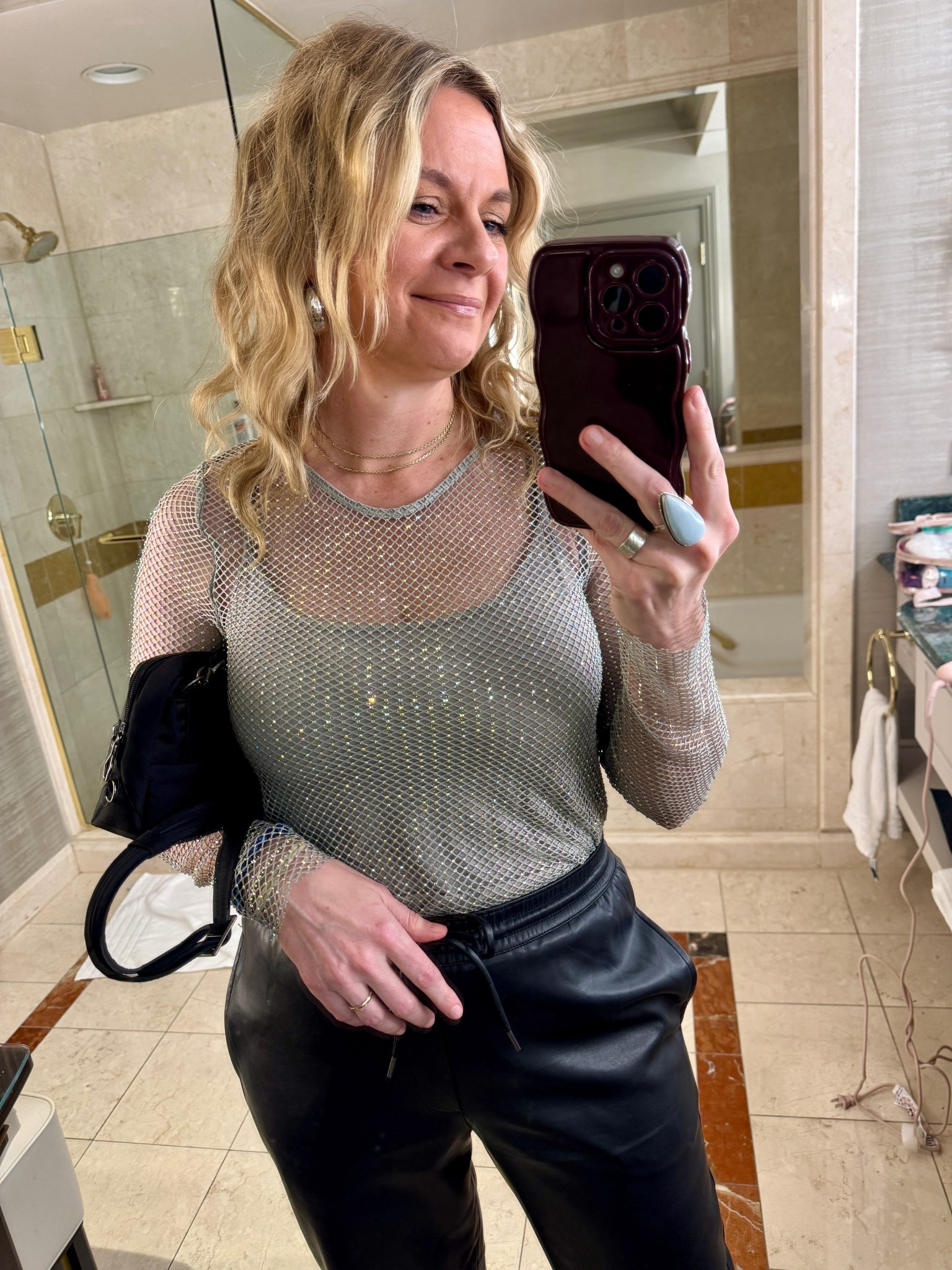 My Vegas Night 1 Look🌟

Night one in Vegas was packed—dinner reservations, a show, and drinks at a speakeasy bar. I wanted to lean into the Vegas energy and take my usual elevated casual style up a notch. When in Vegas, right?

This sheer mesh top from Nuuly was perfect for that. It had just the right amount of sparkle and edge without feeling costumey. I paired it with faux leather joggers I already owned and black block heel sandals. The joggers kept me comfortable through a long night of walking and sitting, while the heels and statement top made it feel special.

#LTKootd #LTKdayinmylife #LTKgrwm