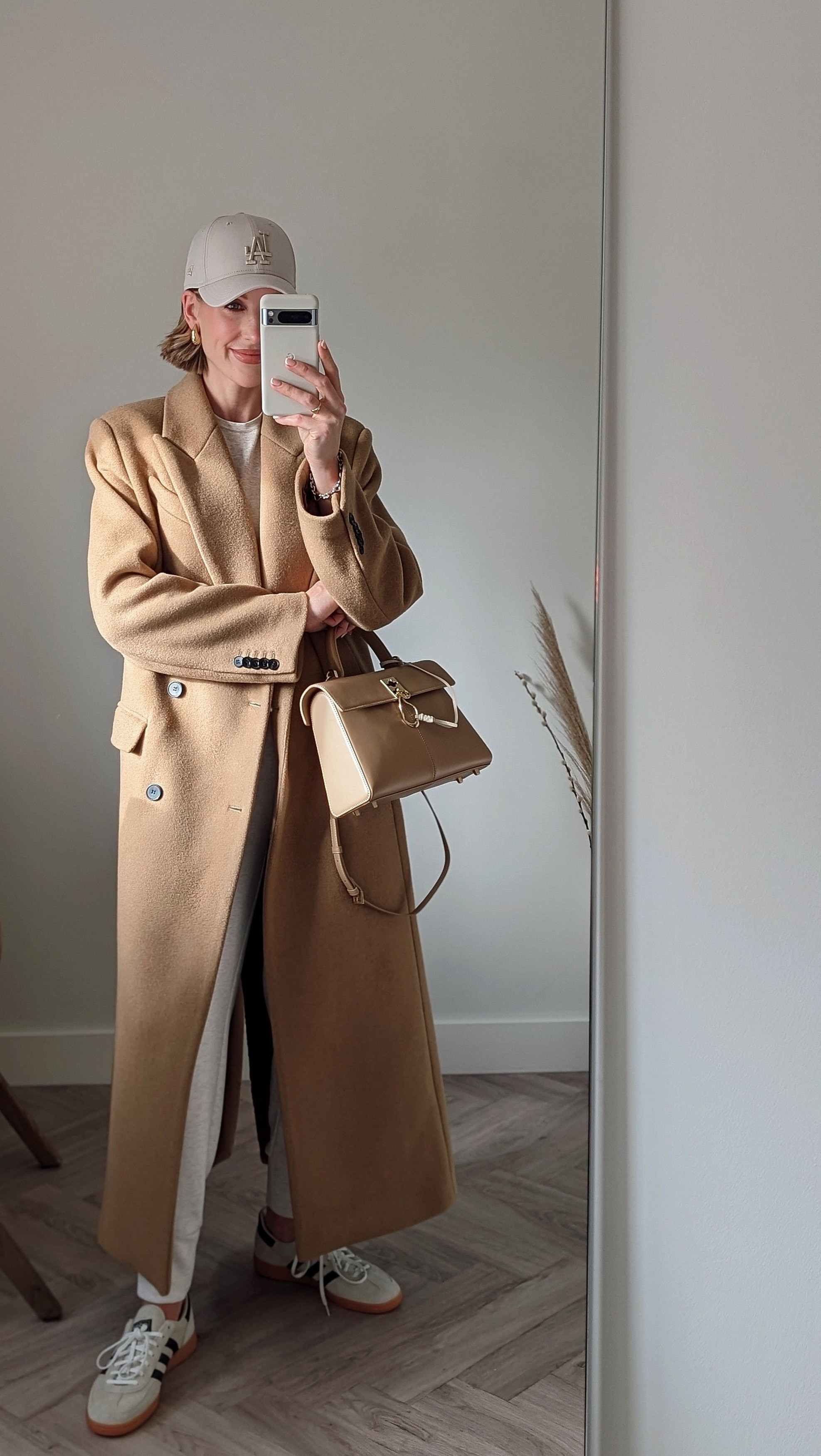 DAY 2 - 30 DAYS OF OUTFITS • skims t-shirt• Camel wool coat (similar linked)• Stone baseball cap• Cafune stance bag• Adidas Spezial trainers• Varley joggers • Amazon earrings #woolcoat #casual #longcoat #tomboychic #adidasspezial #skims

#LTKSeasonal #LTKshoecrush #LTKeurope