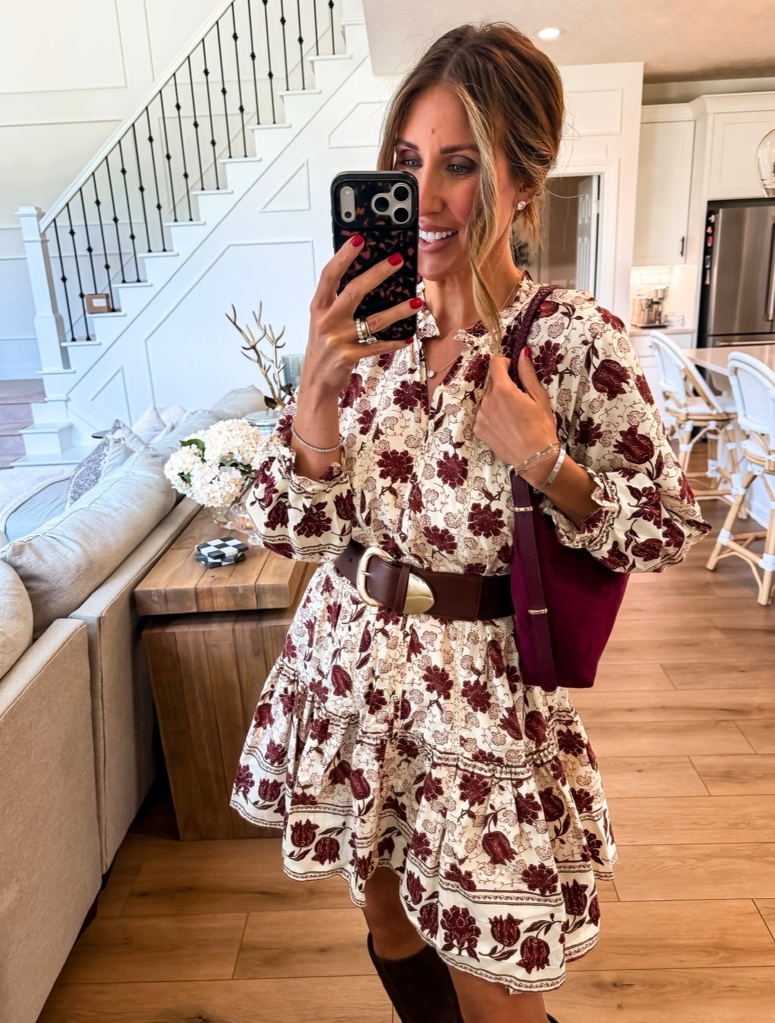 This floral mini is such a good fall dress moment. The burgundy print, wide brown belt, and tall suede boots make it feel seasonal, while the looser sleeves and tiered skirt keep the shape soft and flattering.

floral fall dress, fall mini dress, burgundy floral dress, tall boots outfit, suede boots, belted dress, fall date night outfit, fall dress outfit, women over 40 fashion, autumn style, fall outfit ideas, TheMomInStyle