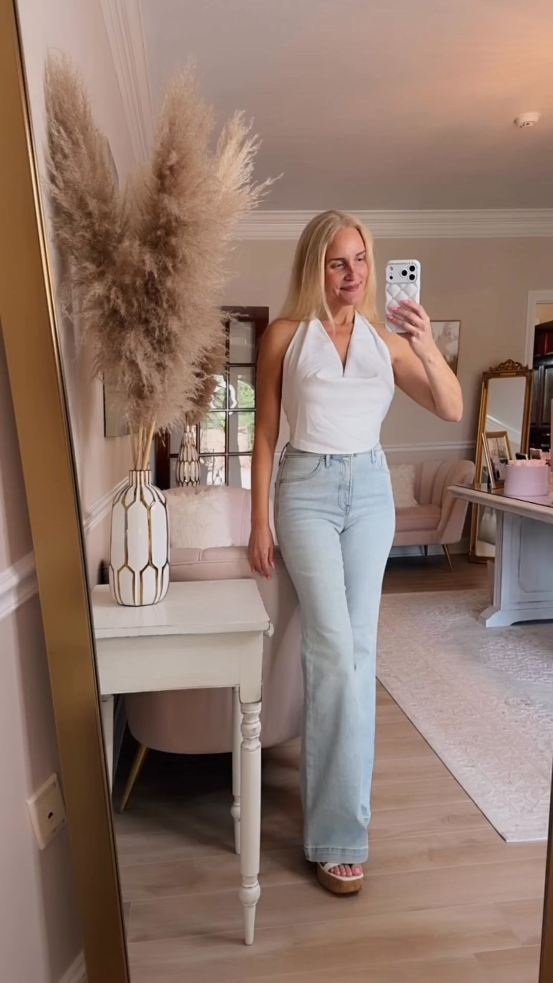 This white top is the perfect sexy going out top for a night out in the city. Ties on the back and neck so fully adjustable. Wearing a small. It runs a little big so you can size down between sizes, even with a large larger bust.

Also I am obsessed with these flare jeans! Comfy and so flattering! Run a little small so size up one if between sizes.￼

#LTKdayinmylife #LTKgrwm #LTKootd