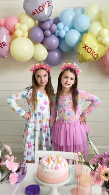 Sweethearts 💜🩷 

#ad found the most perfect conversation hearts dresses to match our Valentine’s party this year. @bumsandrosesofficial bamboo material clothes are silky smooth, stretchy and so comfortable on skin. 


#ltkfamily #ltkkids #sisters #family #mom #matchingfamily #matchingpajamas#bamboopajamas #kidsclothes #kidsfashion #valentinesdecor #valentinesgift #valentinesparty #valentinesday #lovebasket #ltkparties  