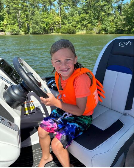 Memphis driving the boat! This life jacket is super cute and I love that it’s neon orange so we can always spot him in the water. 

life jacket l kids l swim l boating

#LTKkids