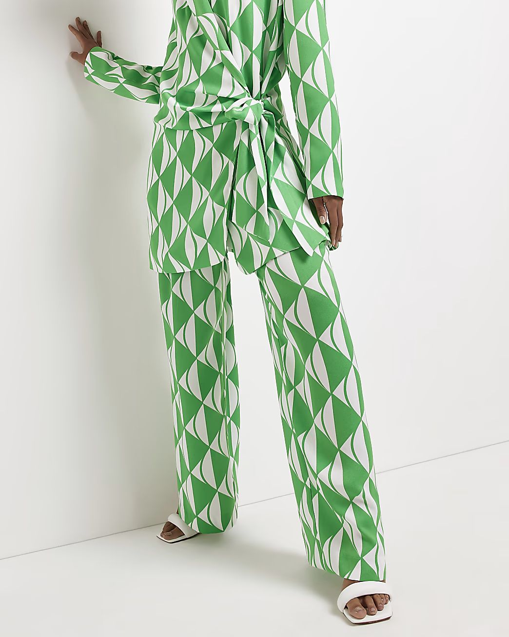 Green geometric print wide leg trousers | River Island (UK & IE)