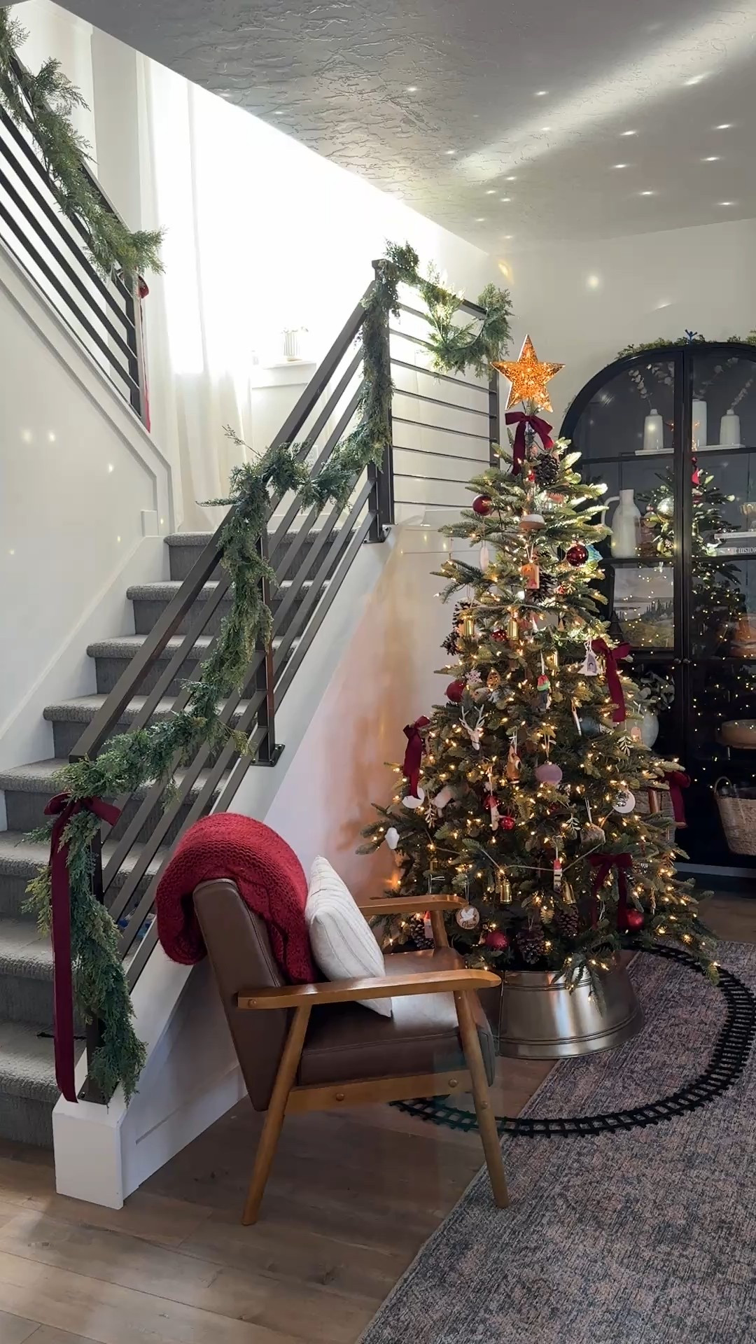The secret to a magical glow in the whole room in the daytime is a well-placed disco ball ornament right where the sunlight streams in. It’s one of my favorite holiday hacks. 🪩 
Also our popular black arched cabinets are on Black Friday sale at McGee & Co. 
And the linked garland prices at Michael’s and Amazon are a steal too. 

#LTKSaleAlert #LTKHoliday #LTKHome