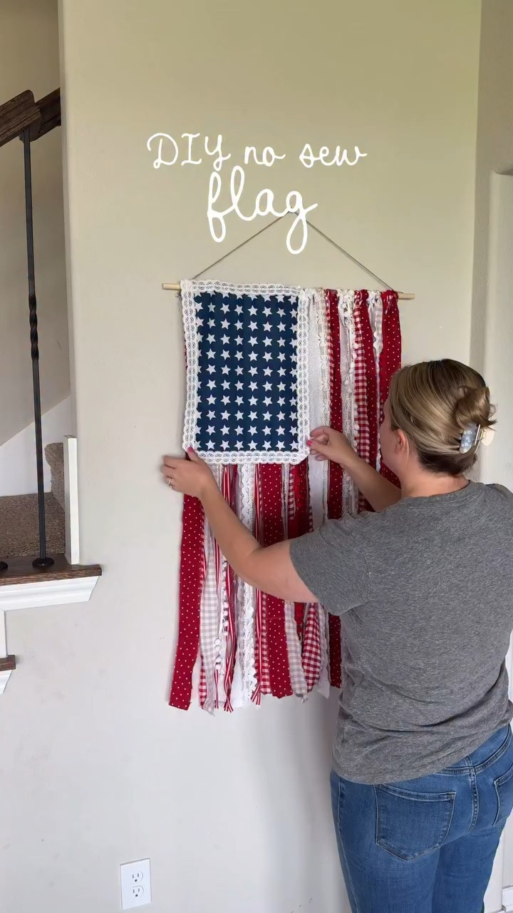 This rag flag was so easy to make. 🇺🇸 it’s time to make it just in time for Fourth of July. ✨

Comment FLAG and I’ll send a message of everything I used 🇺🇸

How to make it:
Rip strips of fabric I did two different red and white. I added ribbons as well. 

Tie your strips alternating red/white to your dowel. Attach the union(starts) to the flag. You can add lace or ribbon on the sides to make it look extra cute. 

#americana #patrioticdecor #summerdecor #diytutorial #summercraft summertime diysummer redwhiteblue craftymom Fourth of July summerfun 4thofjuly dotcake

#LTKSeasonal #LTKdayinmylife #LTKHome