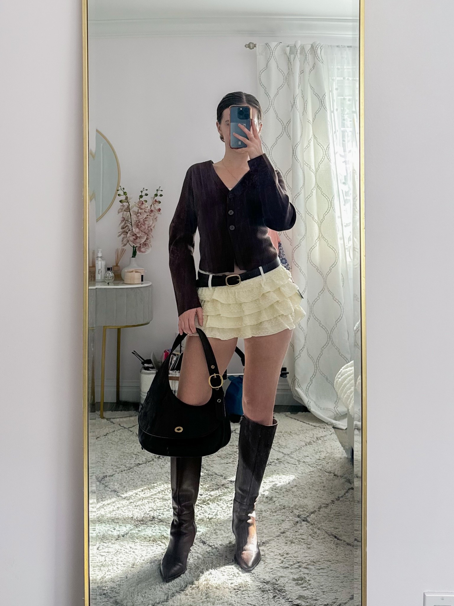 Cozy fall outfit inspo 🍂 Pair a chic brown cardigan with a white ruffle mini skirt, brown knee high boots, a matching shoulder bag, and a belt for the perfect layered look. Ideal for pumpkin picking, brunch dates, coffee runs, or a day out exploring the city.
.
.
.
.
.


Fall outfits | fall shoes | fall boots | cardigan sweater | cardigan outfits | cardigan fall | skirt outfit | skirt and sweater | skirt and boots | ruffle skirt | tiered skirt | white skirt outfit | brown boots outfit | heeled boots | long boots | leather boots | fall bags | brown bag | 

#LTKSeasonal #LTKU #LTKSaleAlert #LTKFindsUnder50 #LTKFindsUnder100 #LTKStyleTip #LTKTravel #LTKShoeCrush #LTKItBag